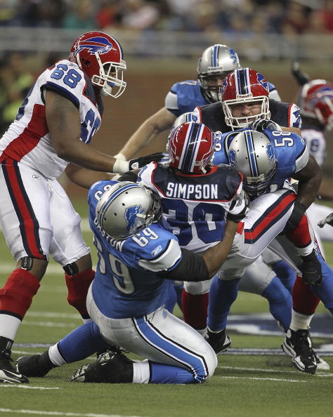 DETROIT - SEPTEMBER 02: Jaron Baston #69 and Ashlee Palmer #58 of the Detroit Lions make the stop on Chad Simpson #30 of the Buffalo Bills during the preseason game at Ford Field on September 2, 2010 in Detroit, Michigan.  (Photo by Leon Halip/Getty Image