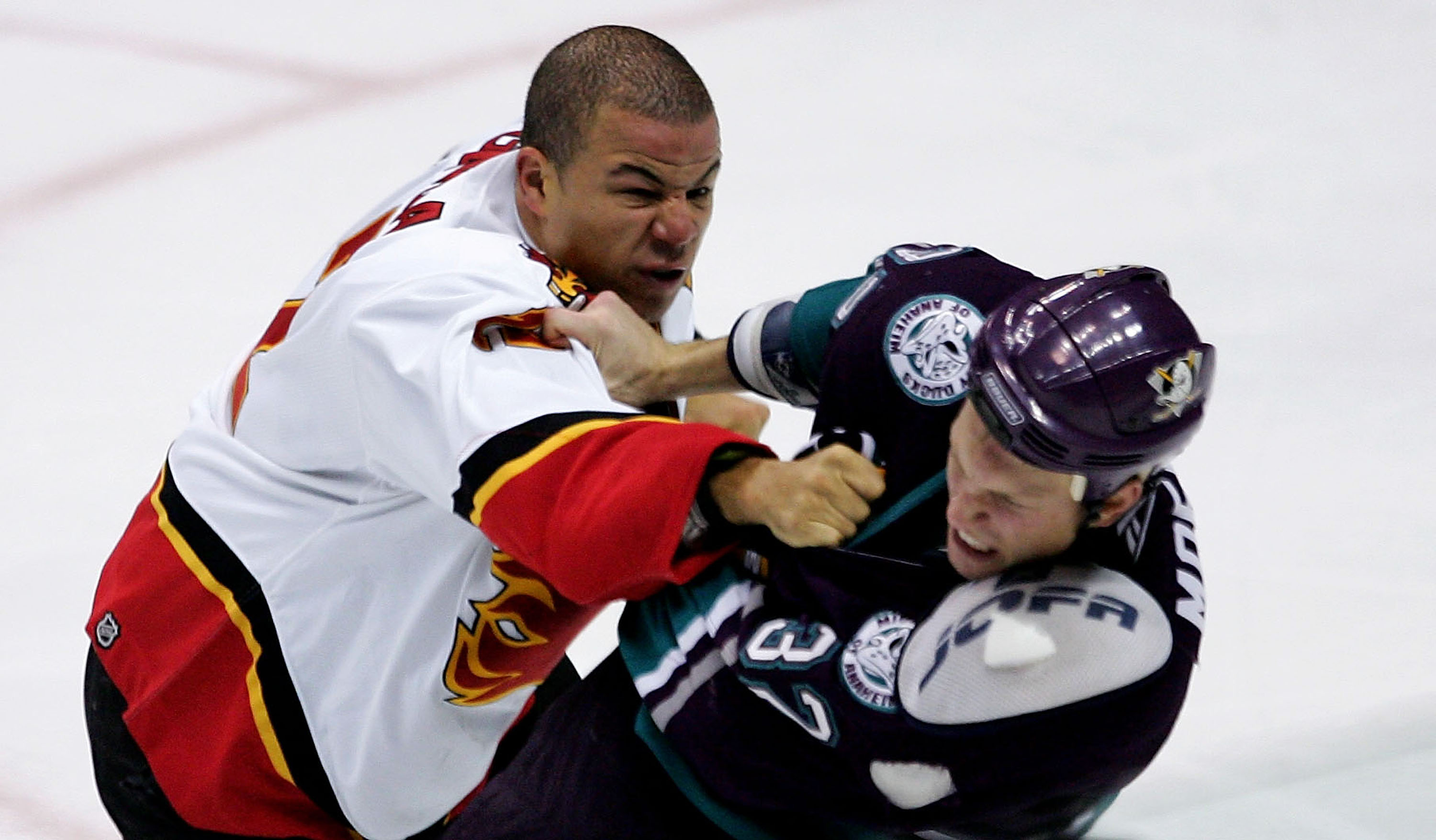 ANAHEIM, CA - OCTOBER 26:  Jarome Iginla #12 of the Calgary Flames fights Travis Moen #32 of the Mighty Ducks of Anaheim during the second period at Arrowhead Pond of Anaheim on October 26, 2005 in Anaheim, California.  (Photo by Robert Laberge/Getty Imag