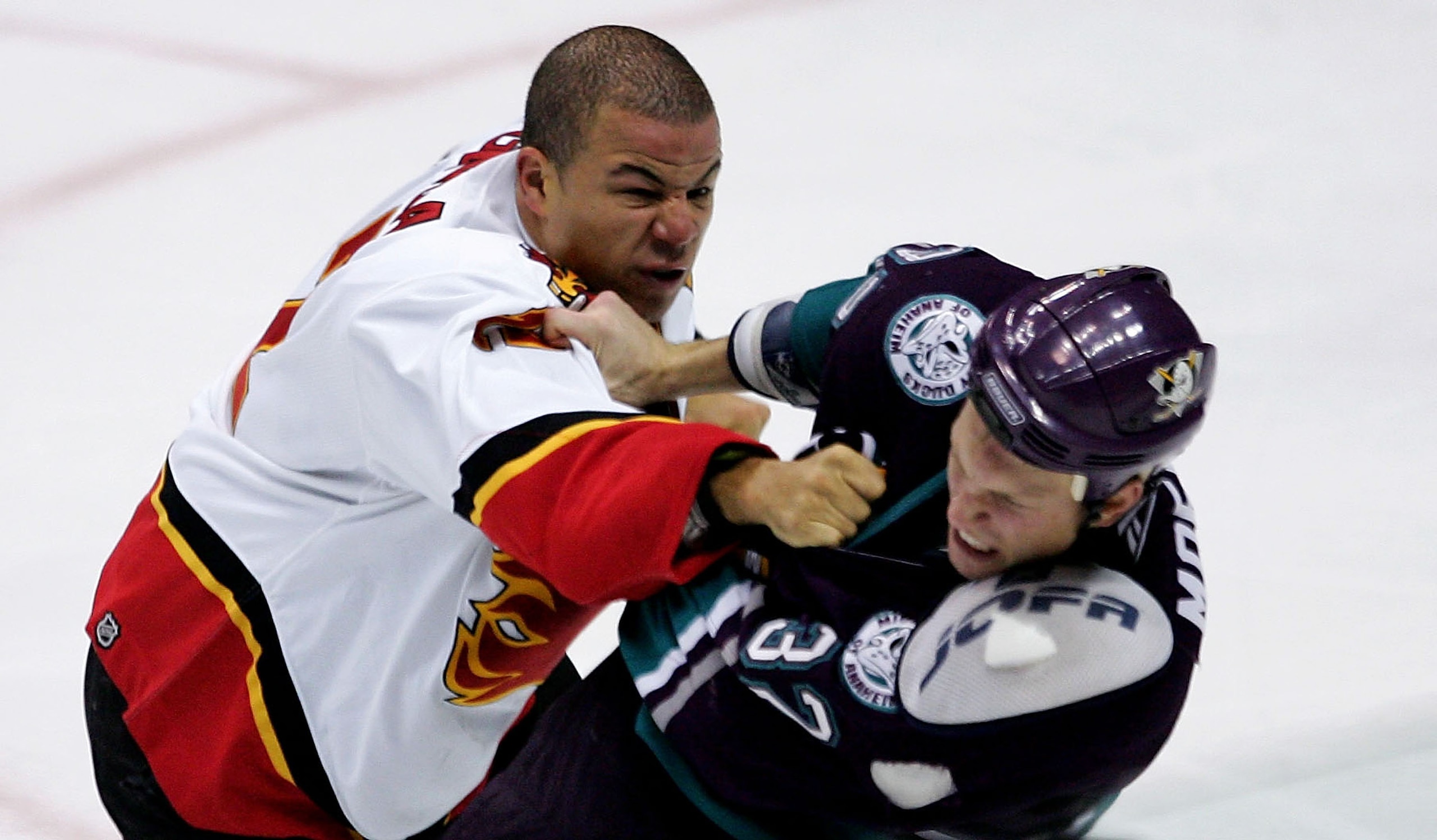 ANAHEIM, CA - OCTOBER 26:  Jarome Iginla #12 of the Calgary Flames fights Travis Moen #32 of the Mighty Ducks of Anaheim during the second period at Arrowhead Pond of Anaheim on October 26, 2005 in Anaheim, California.  (Photo by Robert Laberge/Getty Imag