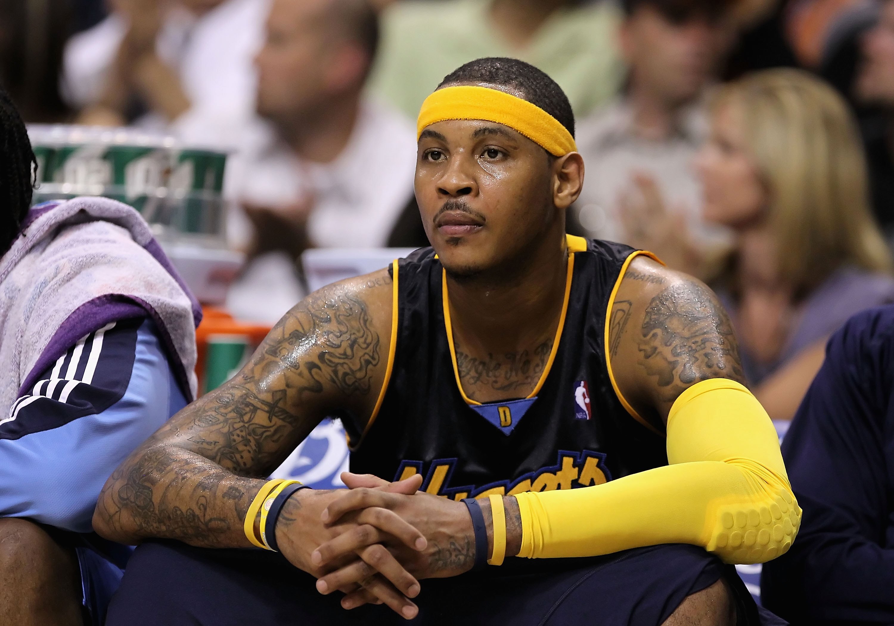 PHOENIX - APRIL 13:  Carmelo Anthony #15 of the Denver Nuggets sits on the bench during the NBA game against the Phoenix Suns at US Airways Center on April 13, 2010 in Phoenix, Arizona. The Suns defeated the Nuggets 123-101.  NOTE TO USER: User expressly