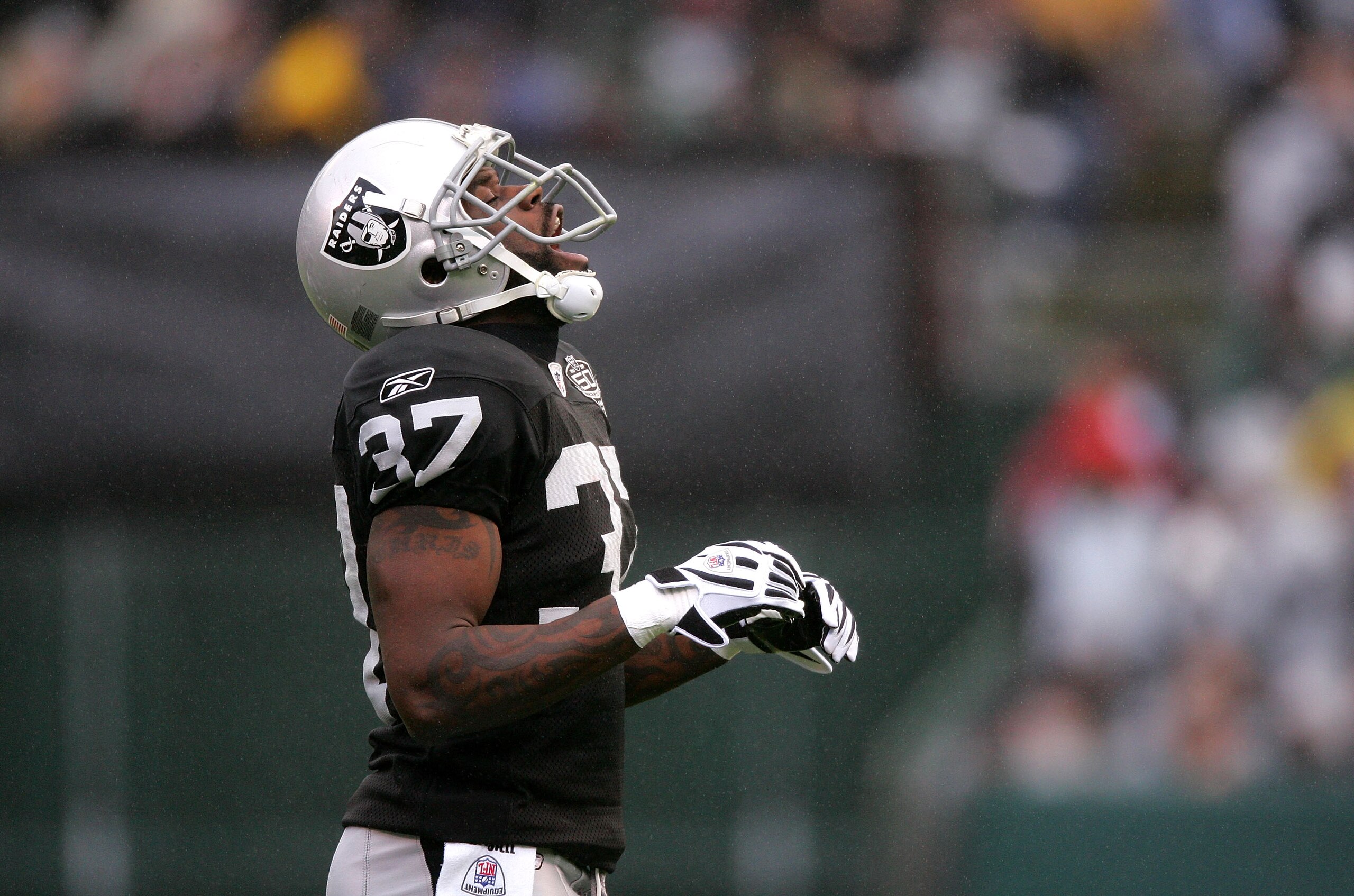 OAKLAND, CA - DECEMBER 13:  Chris Johnson #37 of the Oakland Raiders streches his neck during their game against the Washington Redskins at Oakland-Alameda County Coliseum on December 13, 2009 in Oakland, California.  (Photo by Ezra Shaw/Getty Images)