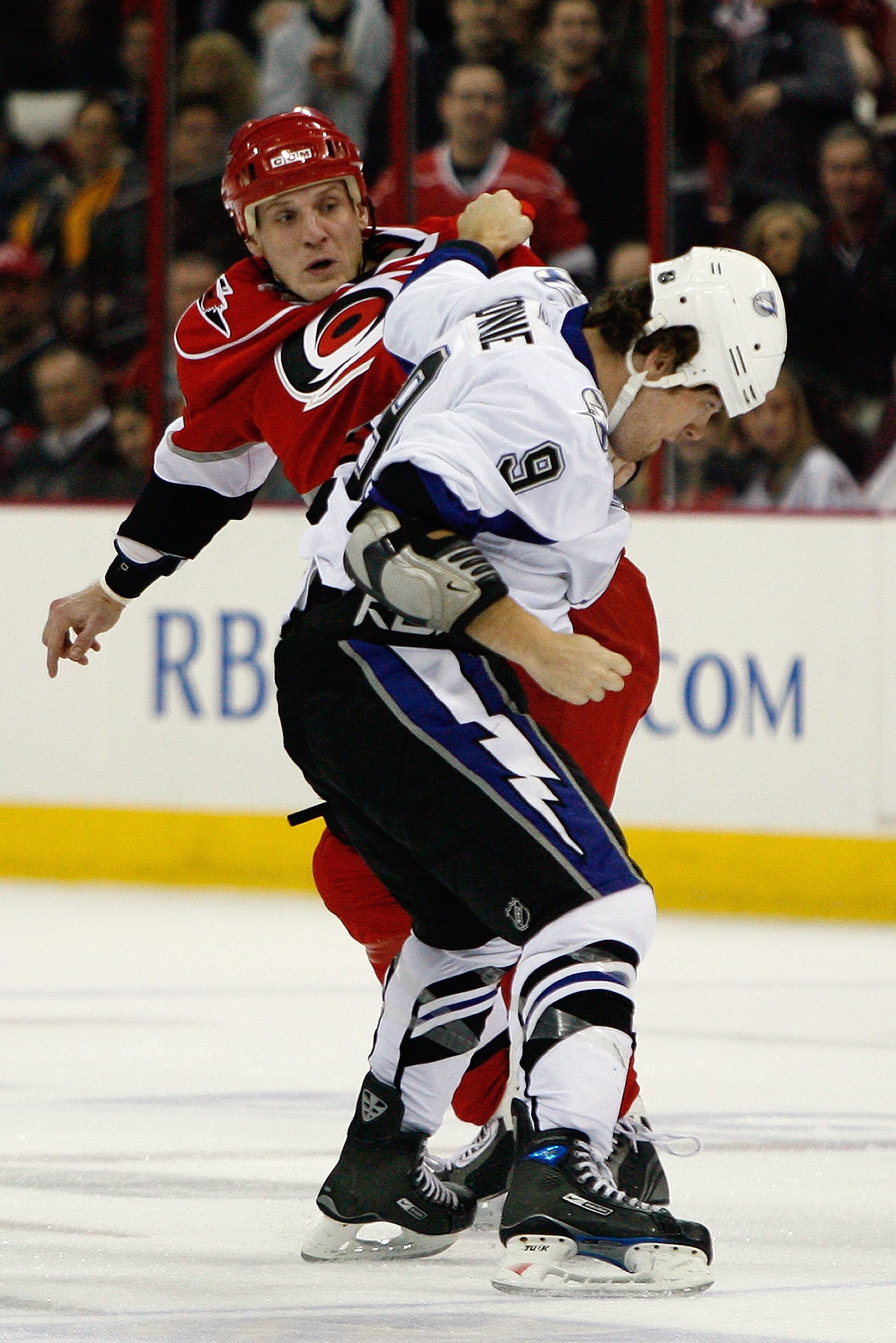 RALEIGH, NC - FEBRUARY 20:  Tim Conboy #38 of the Carolina Hurricanes fights Steve Downie #9 of the Tampa Bay Lightning during the game on February 20, 2009 at RBC Center in Raleigh, North Carolina.  (Photo by Kevin C. Cox/Getty Images)