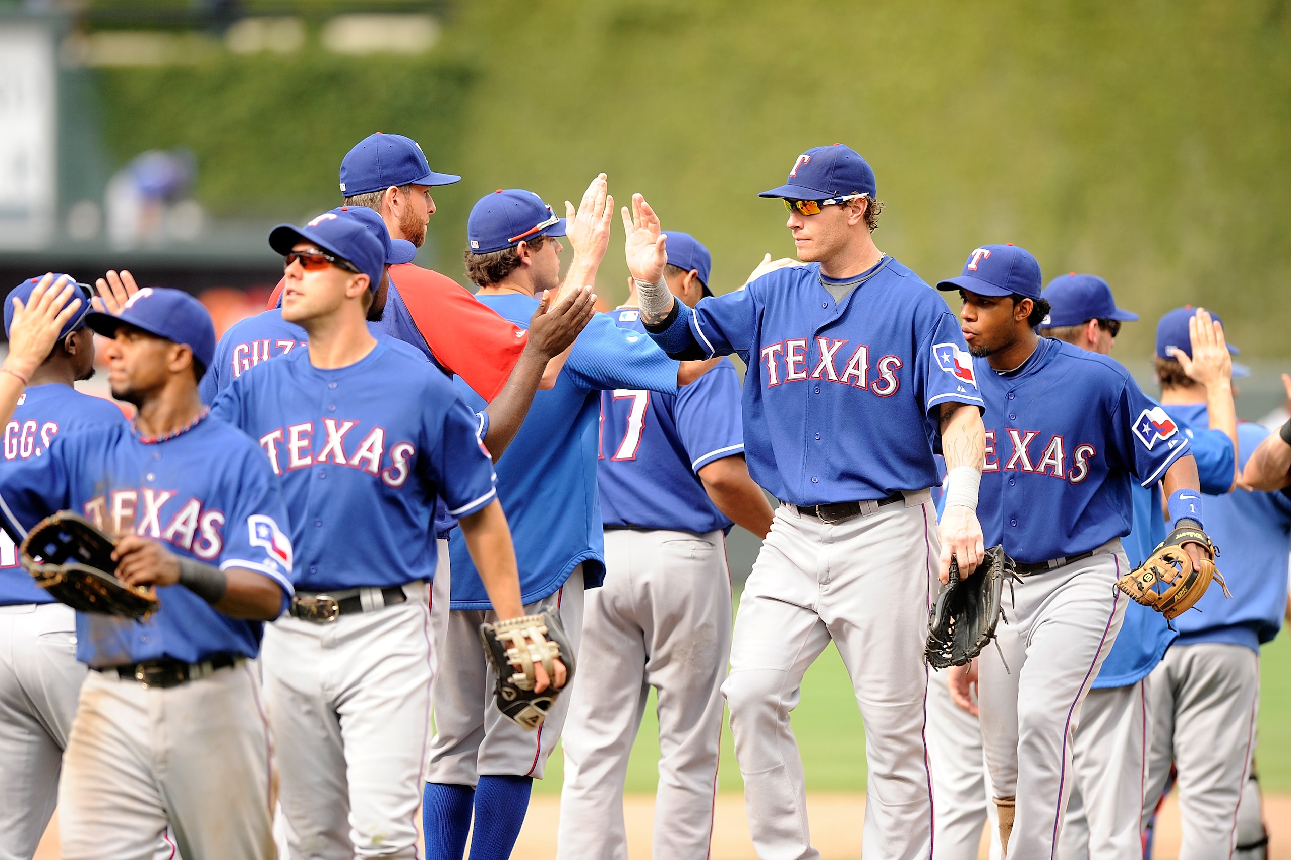 BALTIMORE - AUGUST 22:  Josh Hamilton #32 of the Texas Rangers celebrates with teammates after a 6-4 victory against the Baltimore Orioles at Camden Yards on August 22, 2010 in Baltimore, Maryland.  (Photo by Greg Fiume/Getty Images)