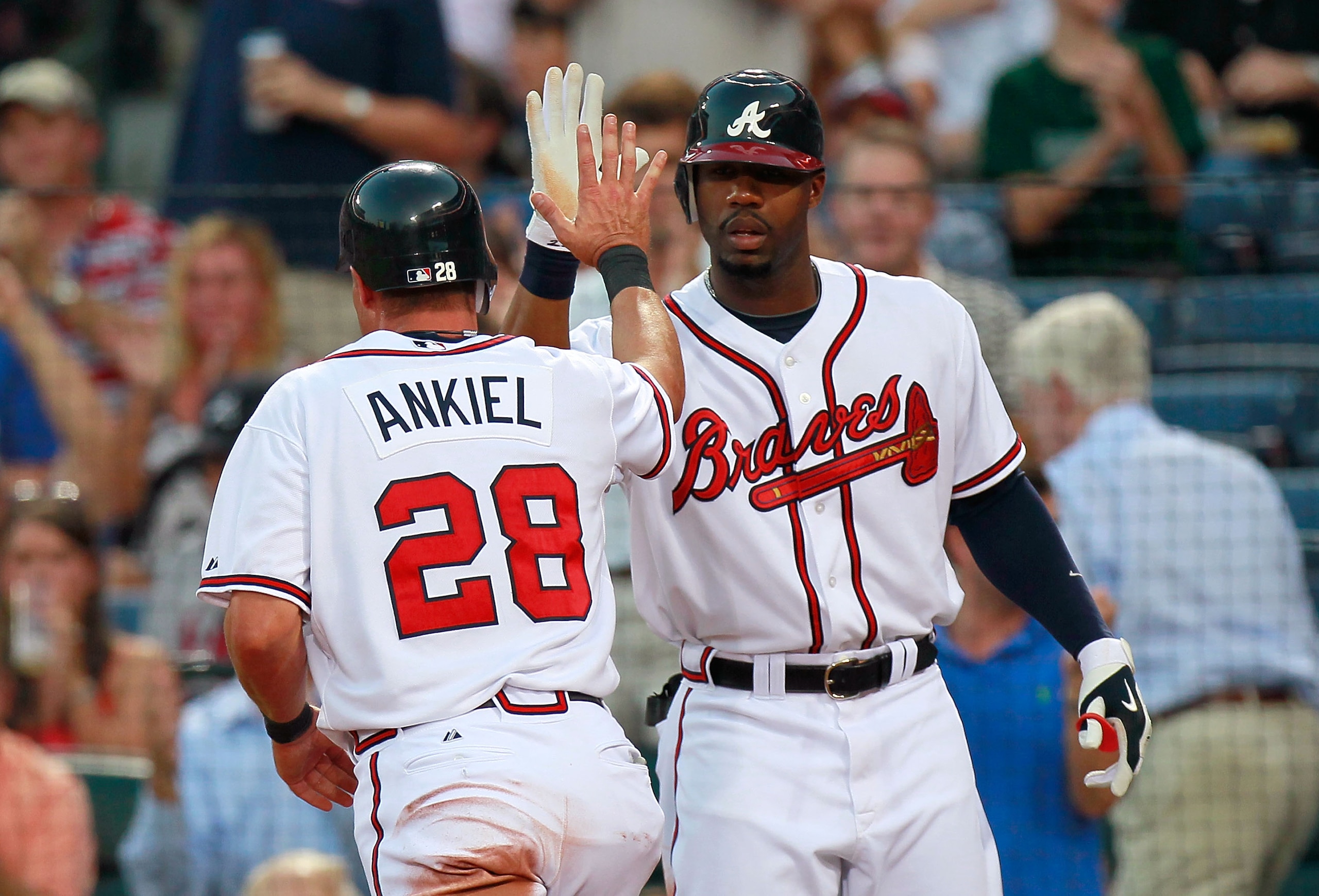 ATLANTA - SEPTEMBER 01:  Jason Heyward #22 of the Atlanta Braves congratulates Rick Ankiel #28 after Ankiel scored against the New York Mets at Turner Field on September 1, 2010 in Atlanta, Georgia.  (Photo by Kevin C. Cox/Getty Images)