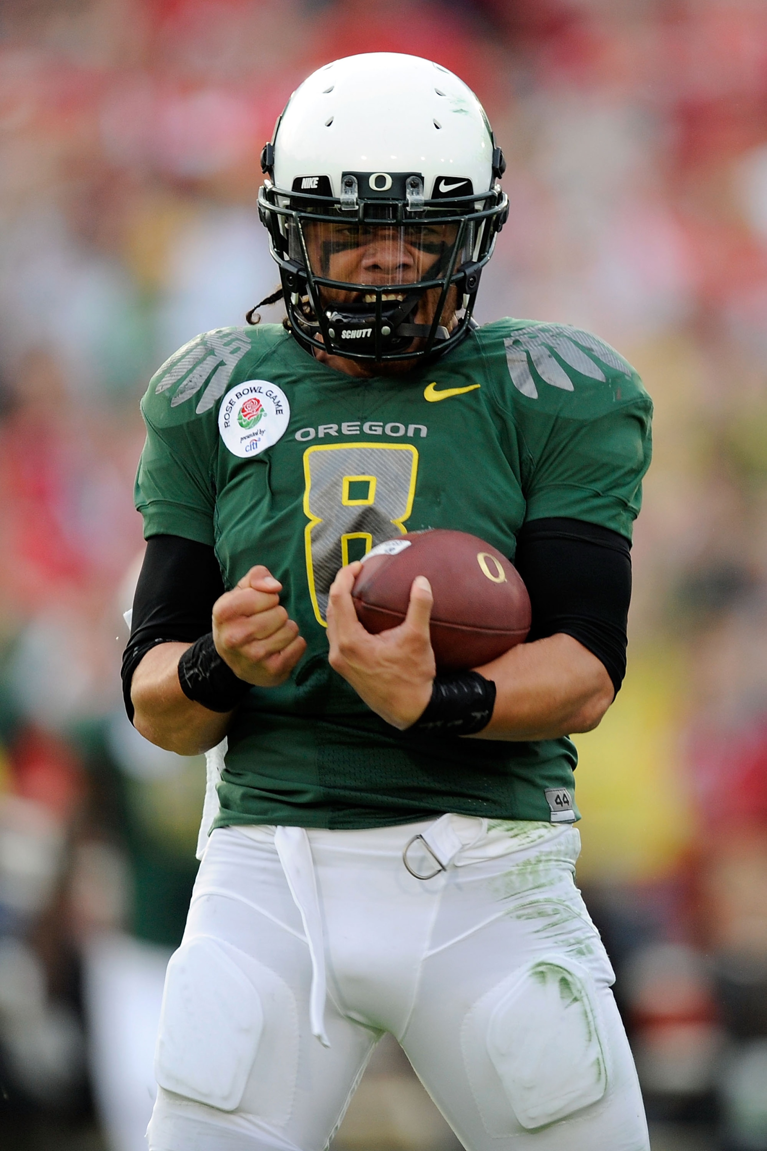 PASADENA, CA - JANUARY 01:  Quarterback Jeremiah Masoli #8 of the Oregon Ducks celebrates after scoring a touchdown against the Ohio State Buckeyes in the 96th Rose Bowl game on January 1, 2010 in Pasadena, California.  (Photo by Kevork Djansezian/Getty I