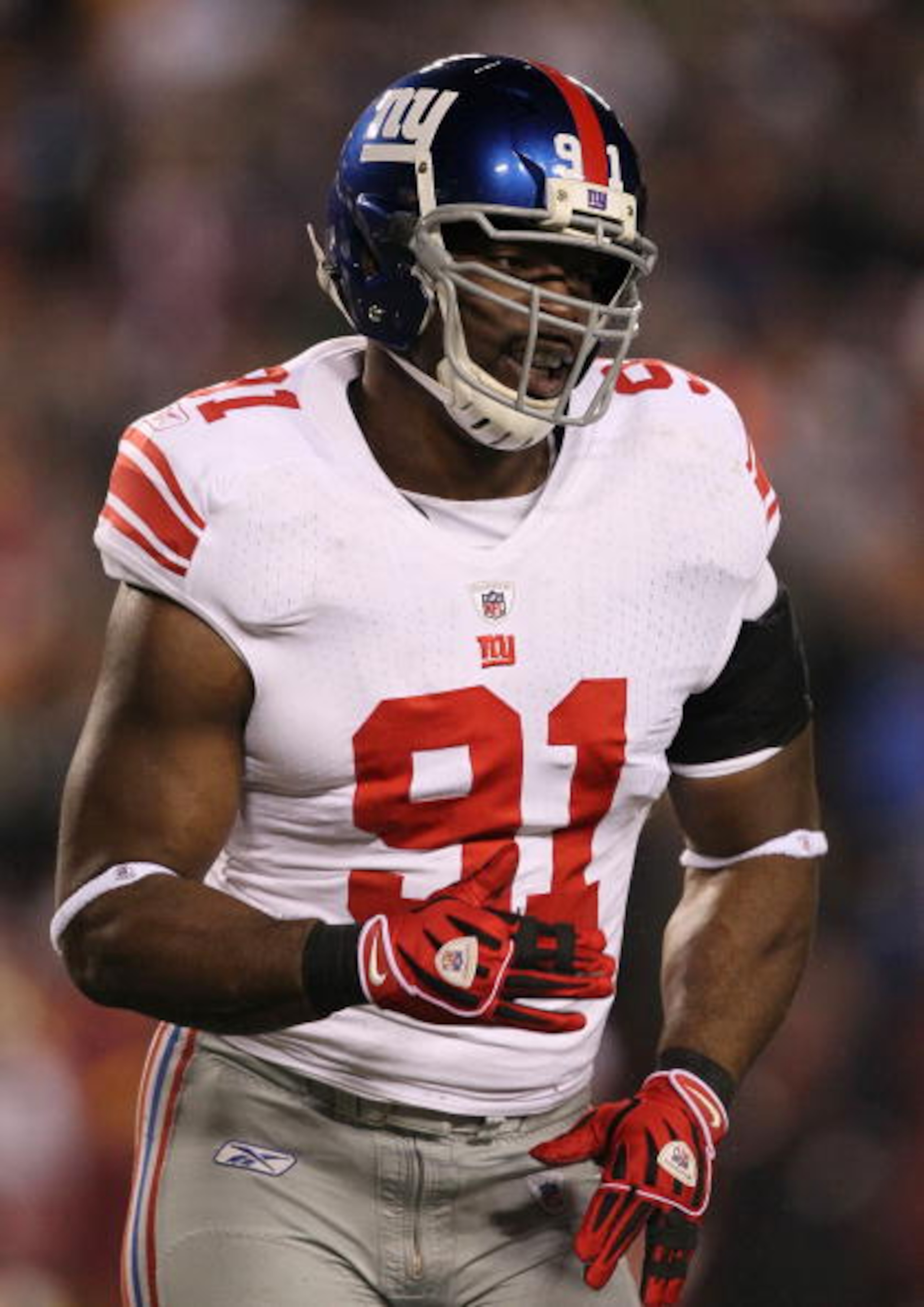 LANDOVER, MD - DECEMBER 21:  Justin Tuck #91 of the New York Giants reacts after a sack in the first half against the Washington Redskins at FedEx Field on December 21, 2009 in Landover, Maryland. (Photo by Al Bello/Getty Images)