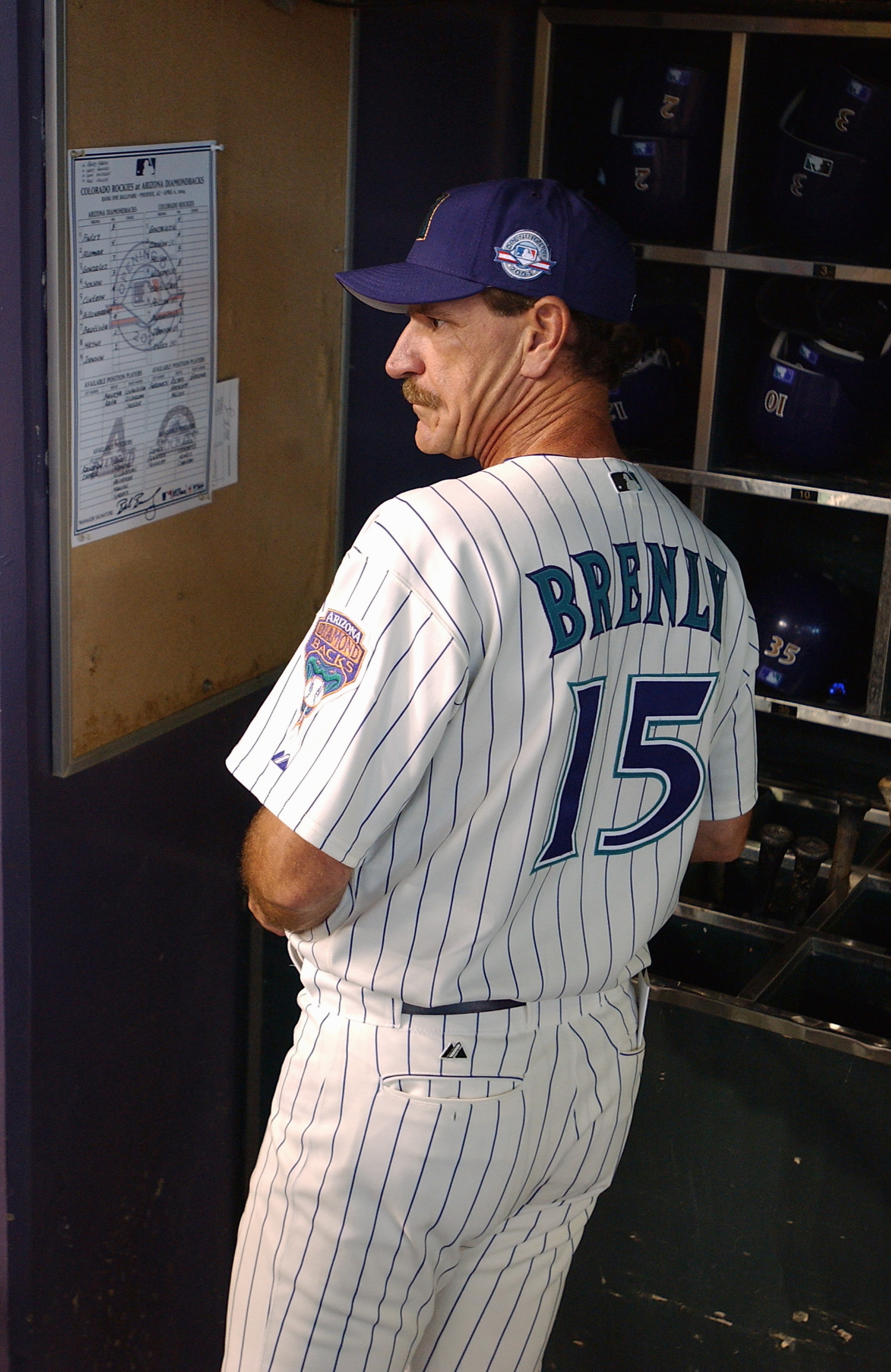 PHOENIX - APRIL 6:  Manager Bob Brenly #15 of the Arizona Diamondbacks watches the Opening Day game against the Colorado Rockies at Bank One Ballpark on April 6, 2004 in Phoenix, Arizona.  The Rockies defeated the Diamondbacks 6-2. (Photo by Barry Gossage