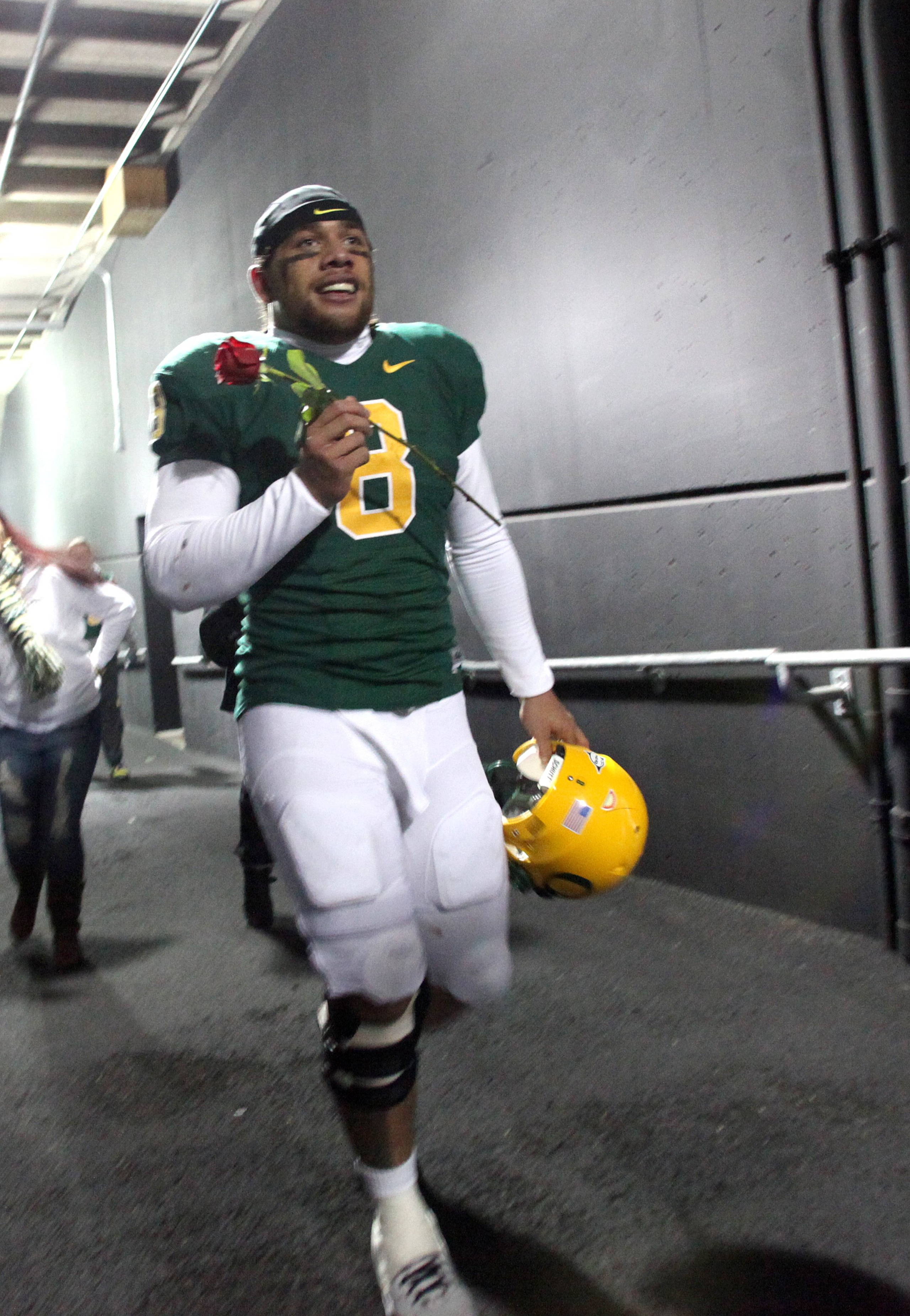 EUGENE, OR - DECEMBER 3:  Quarterback Jeremiah Masoli #8 of the Oregon Ducks celebrates their Civil War victory over Oregon State holding a rose at Autzen Stadium on December 3, 2009 in Eugene, Oregon. The Ducks defeated the Beavers 37-33. (Photo by Tom H
