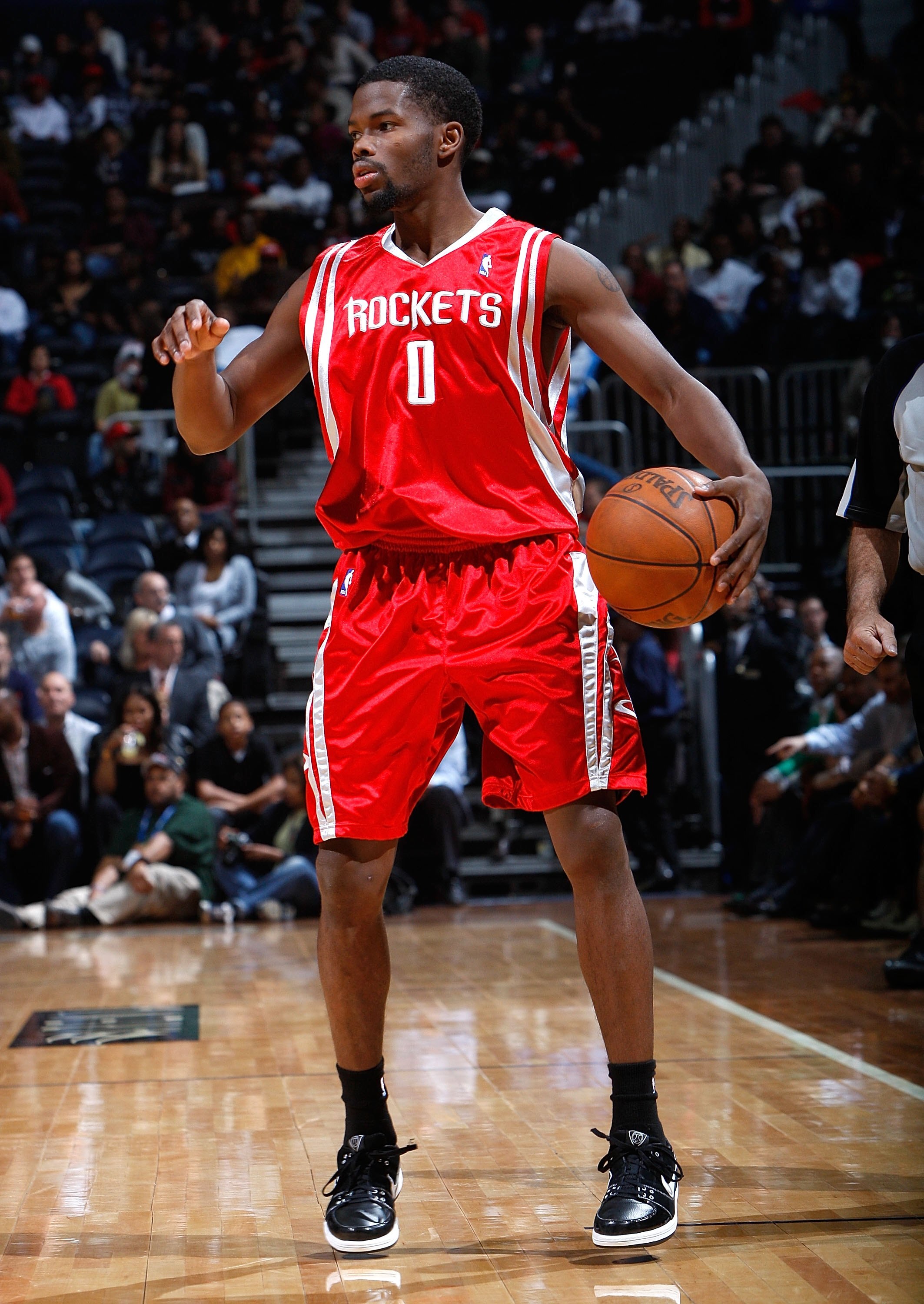 ATLANTA - NOVEMBER 20:  Aaron Brooks #0 of the Houston Rockets against the Atlanta Hawks at Philips Arena on November 20, 2009 in Atlanta, Georgia.  NOTE TO USER: User expressly acknowledges and agrees that, by downloading and/or using this Photograph, Us