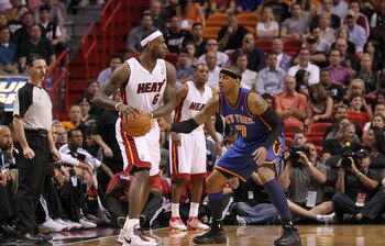 MIAMI, FL - FEBRUARY 27:  LeBron James #6 of the Miami Heat is guarded by Carmelo Anthony #7 of the New York Knicks looks on during a game at American Airlines Arena on February 27, 2011 in Miami, Florida. NOTE TO USER: User expressly acknowledges and agr