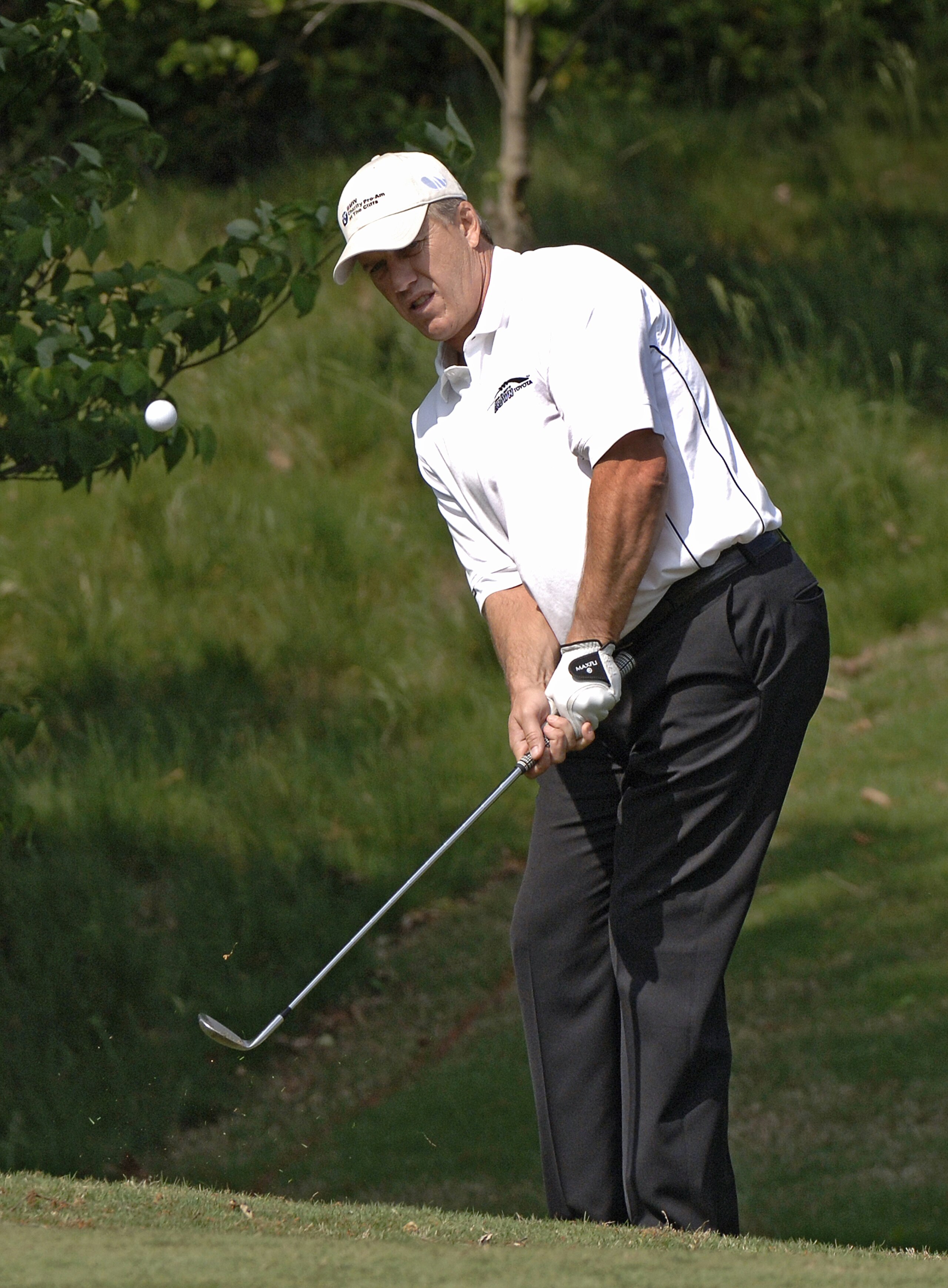UNITED STATES - APRIL 27: John Elway chips into the 15th green at the Cliffs at Keowee Vineyards during the first round of the Nationwide Tour BMW Charity Pro-Am, April 27, 2006 in Greenville, South Carolina. (Photo by Al Messerschmidt/Getty Images) UNITED STATES - APRIL 27: John Elway chips into the 15th green at the Cliffs at Keowee Vineyards during the first round of the Nationwide Tour BMW Charity Pro-Am, April 27, 2006 in Greenville, South Carolina. (Photo by Al Messerschmidt/Getty Images)