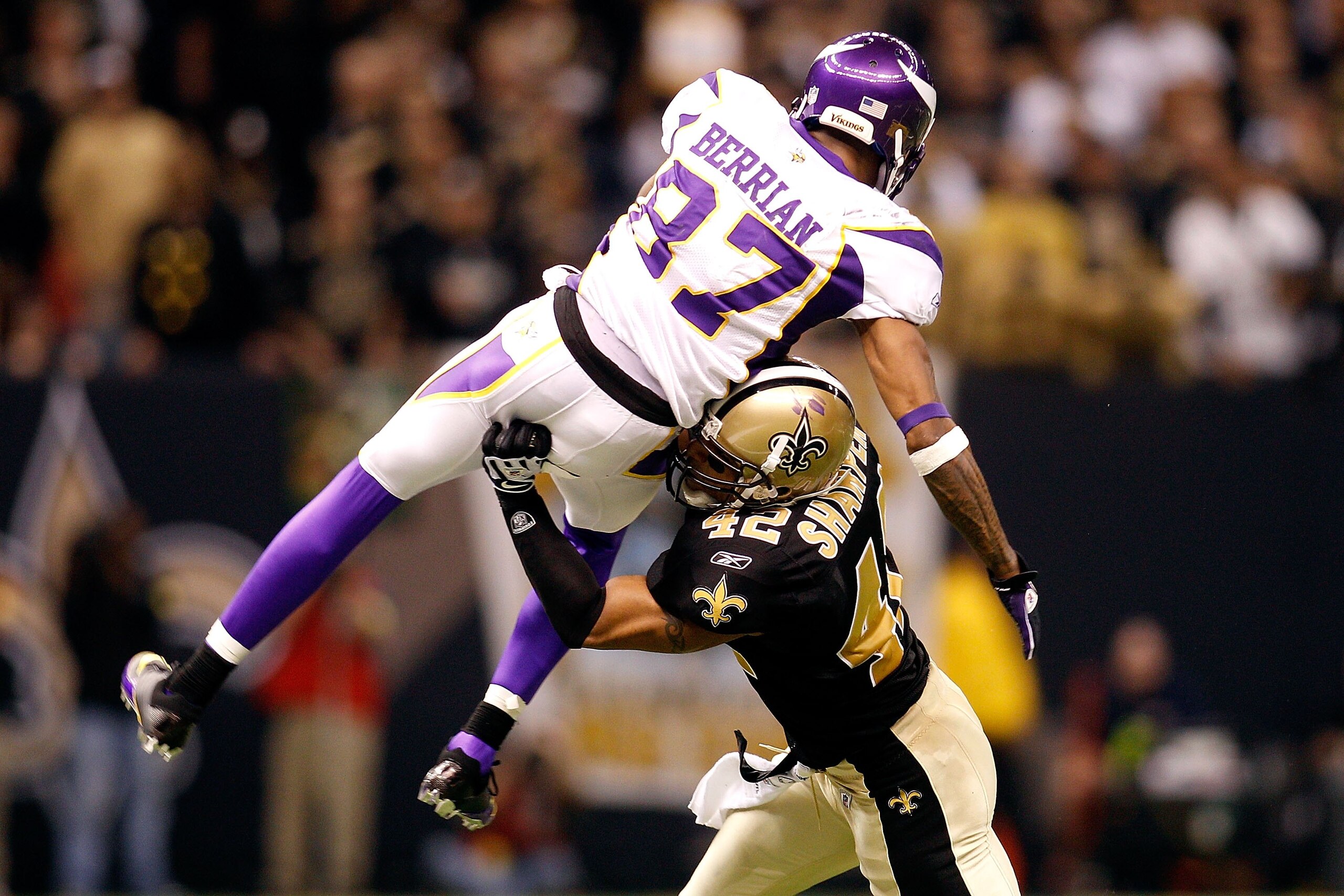 NEW ORLEANS - JANUARY 24:  Darren Sharper #42 of the New Orleans Saints hits Bernard Berrian #87 of the Minnesota Vikings during the NFC Championship Game at the Louisiana Superdome on January 24, 2010 in New Orleans, Louisiana. The Saints won 31-28.  (Ph