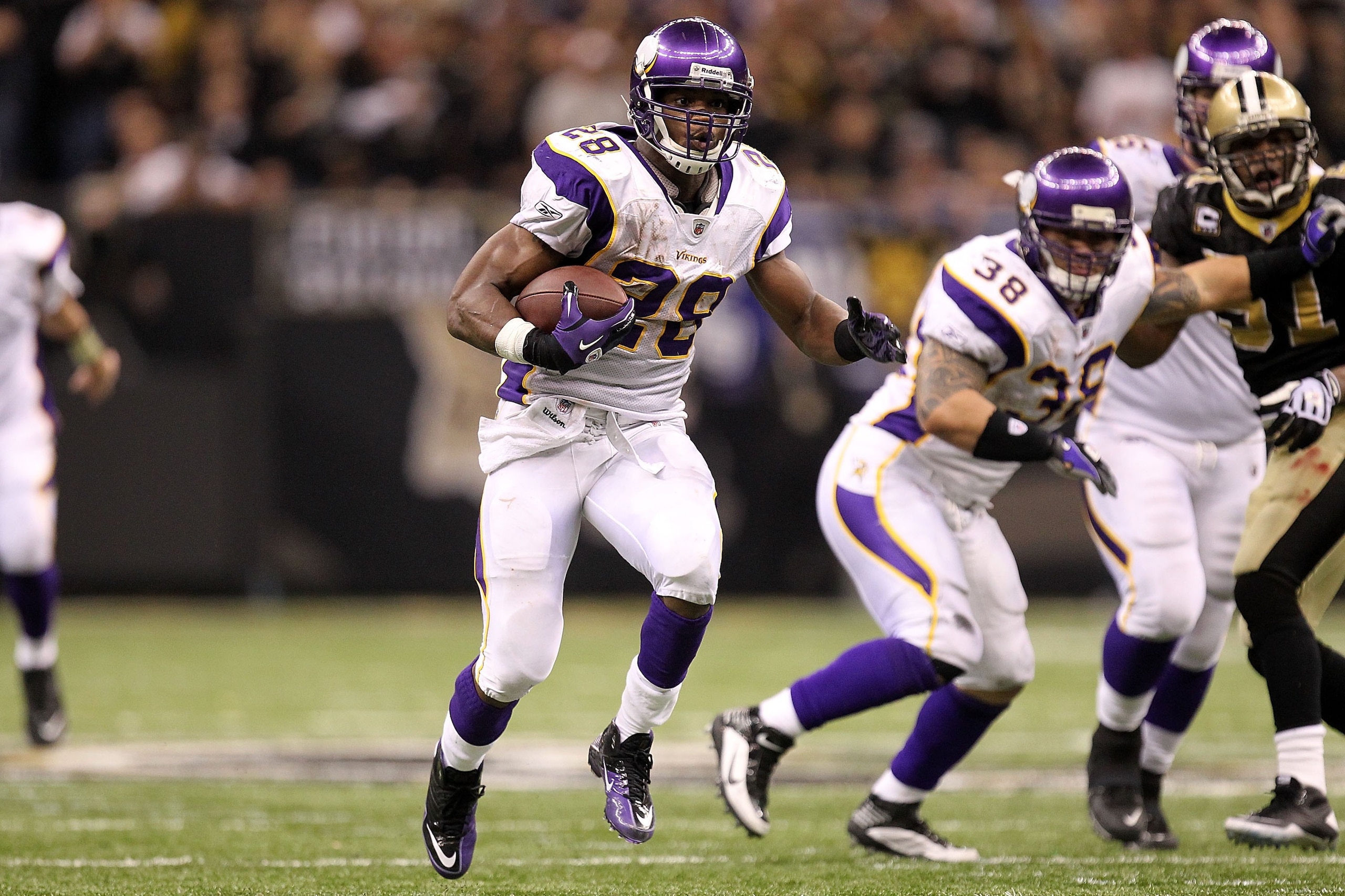 NEW ORLEANS - JANUARY 24:  Adrian Peterson #28 of the Minnesota Vikings runs the ball against the New Orleans Saints during the NFC Championship Game at the Louisiana Superdome on January 24, 2010 in New Orleans, Louisiana.  (Photo by Ronald Martinez/Gett