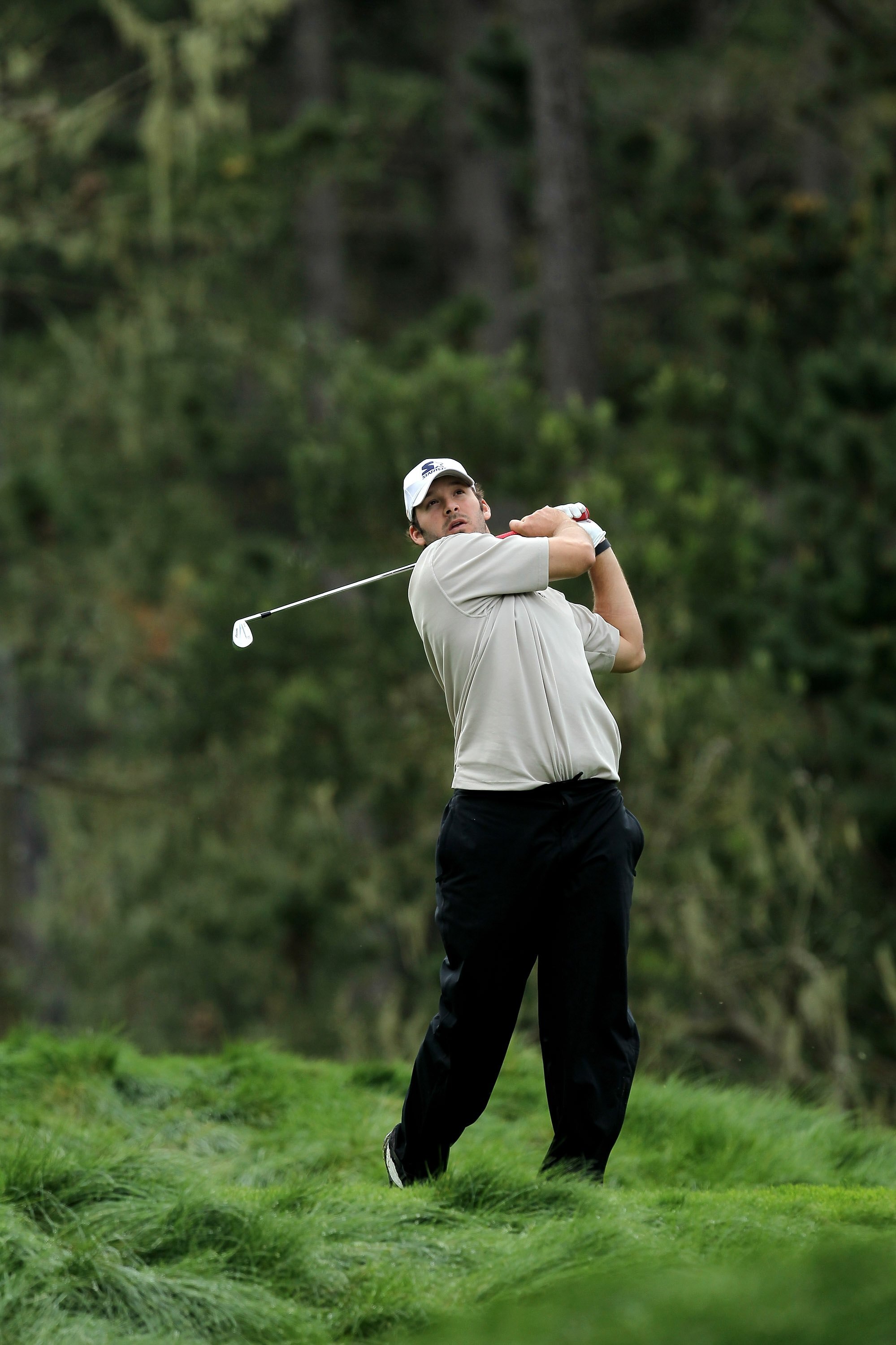 PEBBLE BEACH, CA - FEBRUARY 12:  Dallas Cowboys quarterback Tony Romo hits his tee shot on the 12th hole during the second round of the AT&T Pebble Beach National Pro-Am at Spyglass Hill Golf Course on February 12 2010 in Pebble Beach, California.  (Photo