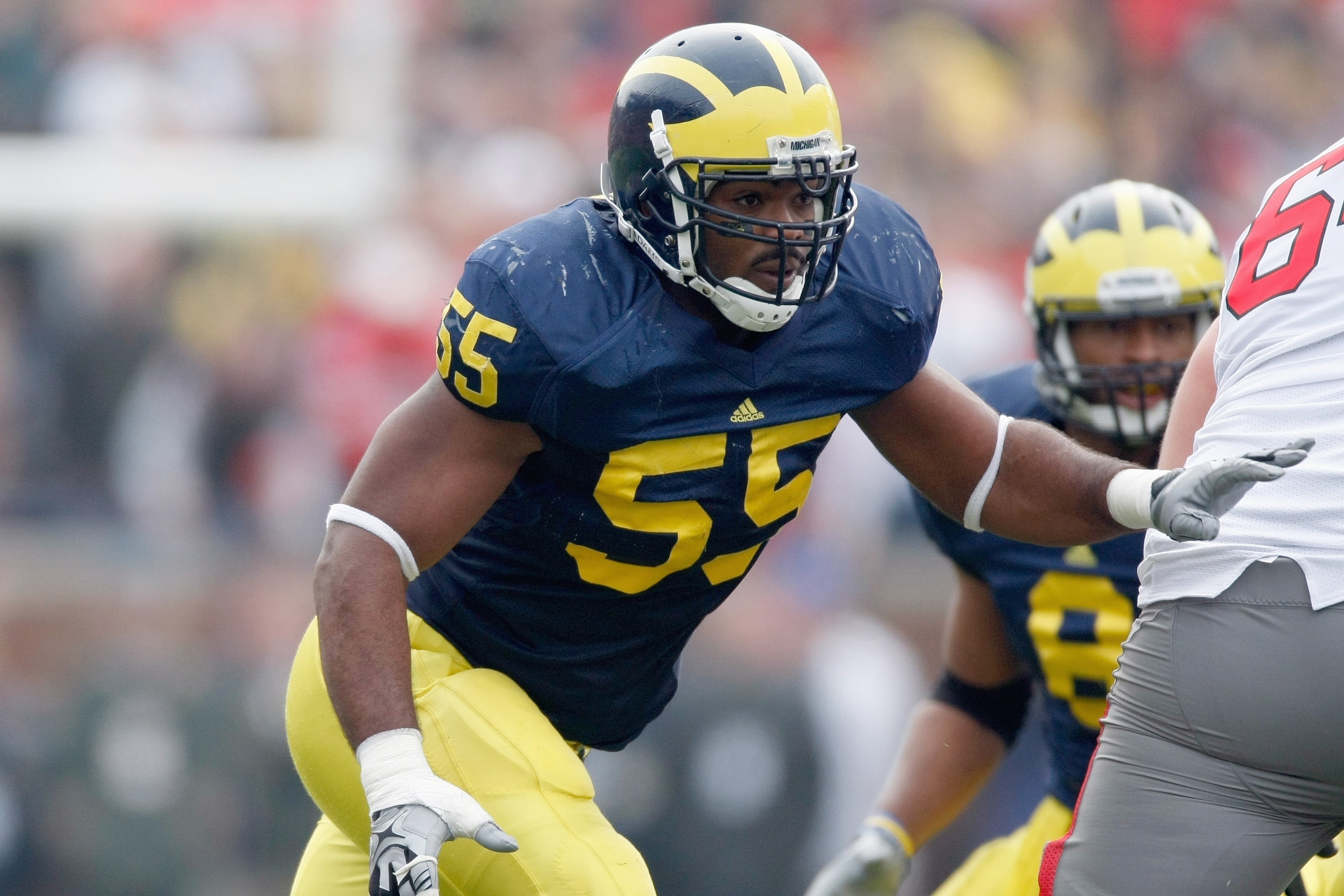 ANN ARBOR, MI - NOVEMBER 21:  Brandon Graham #55 of the Michigan Wolverines moves to blocks during the game against the Ohio State Buckeyes on November 21, 2009 at Michigan Stadium in Ann Arbor, Michigan. Ohio State won the game 21-10. (Photo by Gregory S
