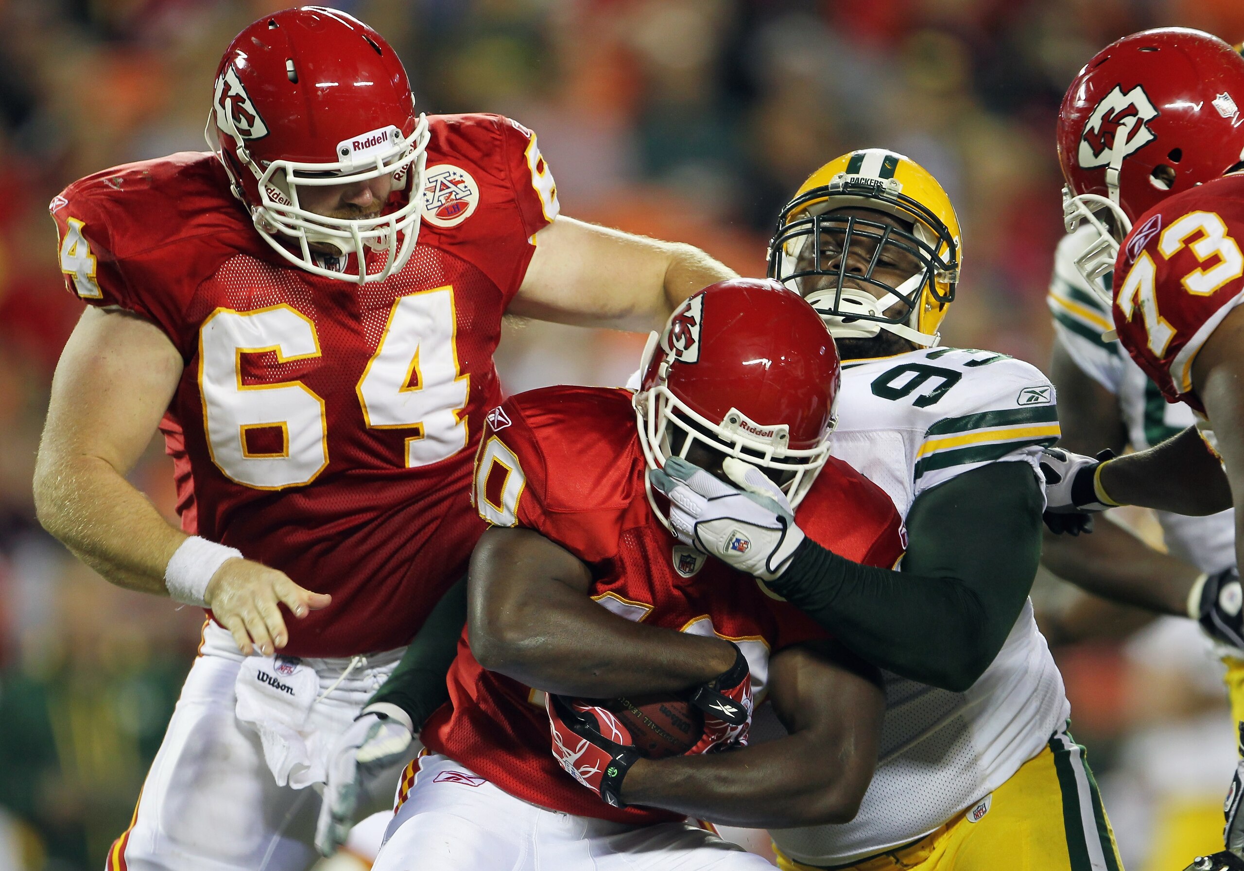 KANSAS CITY, MO - SEPTEMBER 02:  Running back Javarris Williams #40 of the Kansas City Chiefs is facemasked by Anthony Toribio #93 of the Green Bay Packers during the game on September 2, 2010 at Arrowhead Stadium in Kansas City, Missouri.  (Photo by Jami