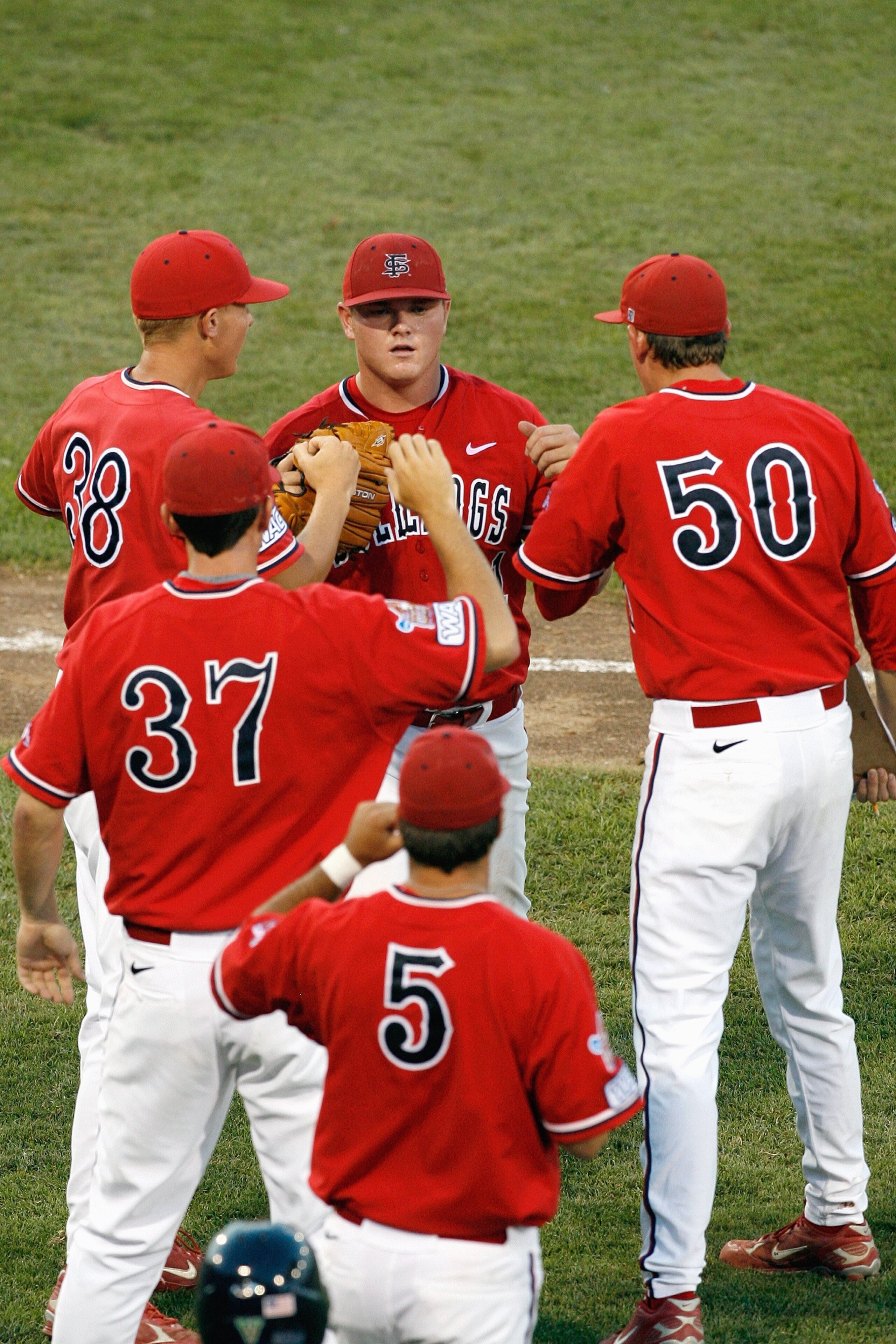 OMAHA, NE - JUNE 25:  Pitcher Justin Wilson #21 of the Fresno State Bulldogs celebrates with teammates as he walks off the field against the Georgia Bulldogs during Game 3 of the 2008 Men's College World Series Championship June 25, 2008 at Rosenblatt Sta