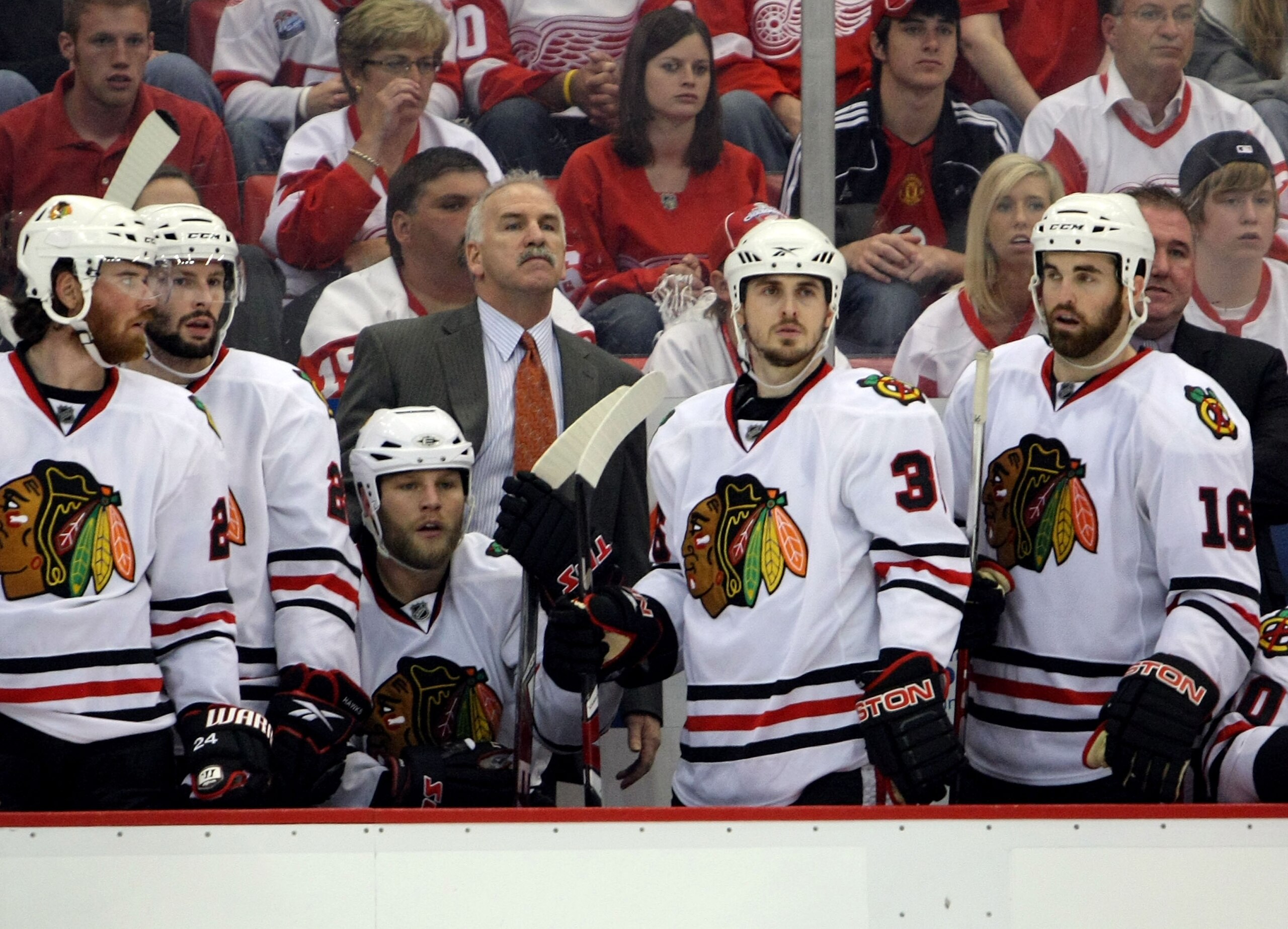 DETROIT - MAY 19:  (L-R) Martin Havlat #24, Troy Brouwer #22, Kris Versteeg #32, Head coach Joel Quennville, Dave Bolland #36 and Andrew Ladd #16 of the Chicago Blackhawks look on from the bench late in the game against the Detroit Red Wings during Game T