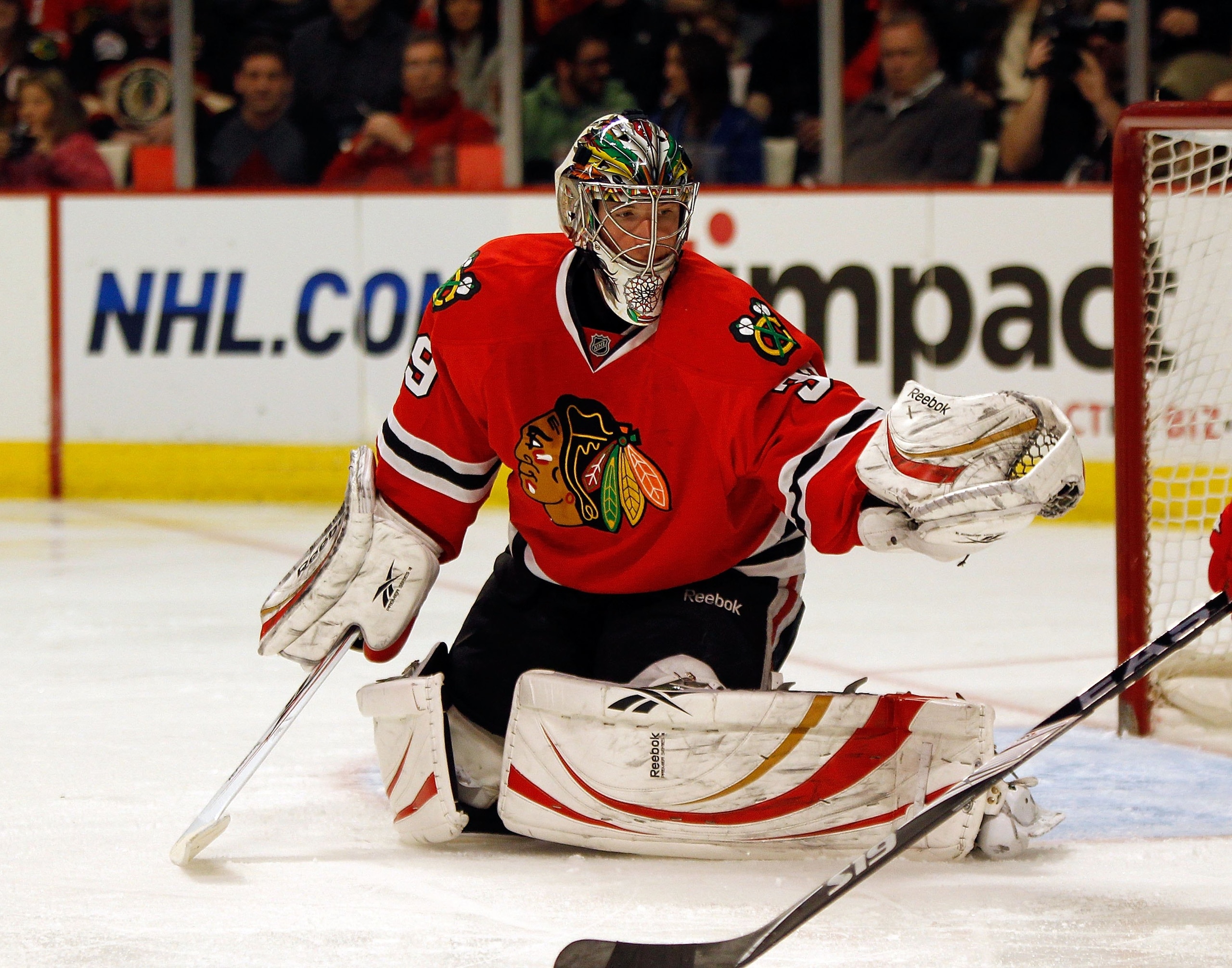 CHICAGO - MARCH 07: Christobal Huet #39 of the Chicago Blackhawks makes a glove save against the Detroit Red Wings at the United Center on March 7, 2010 in Chicago, Illinois. The Red Wings defeated the Blackhawks 5-4. (Photo by Jonathan Daniel/Getty Image