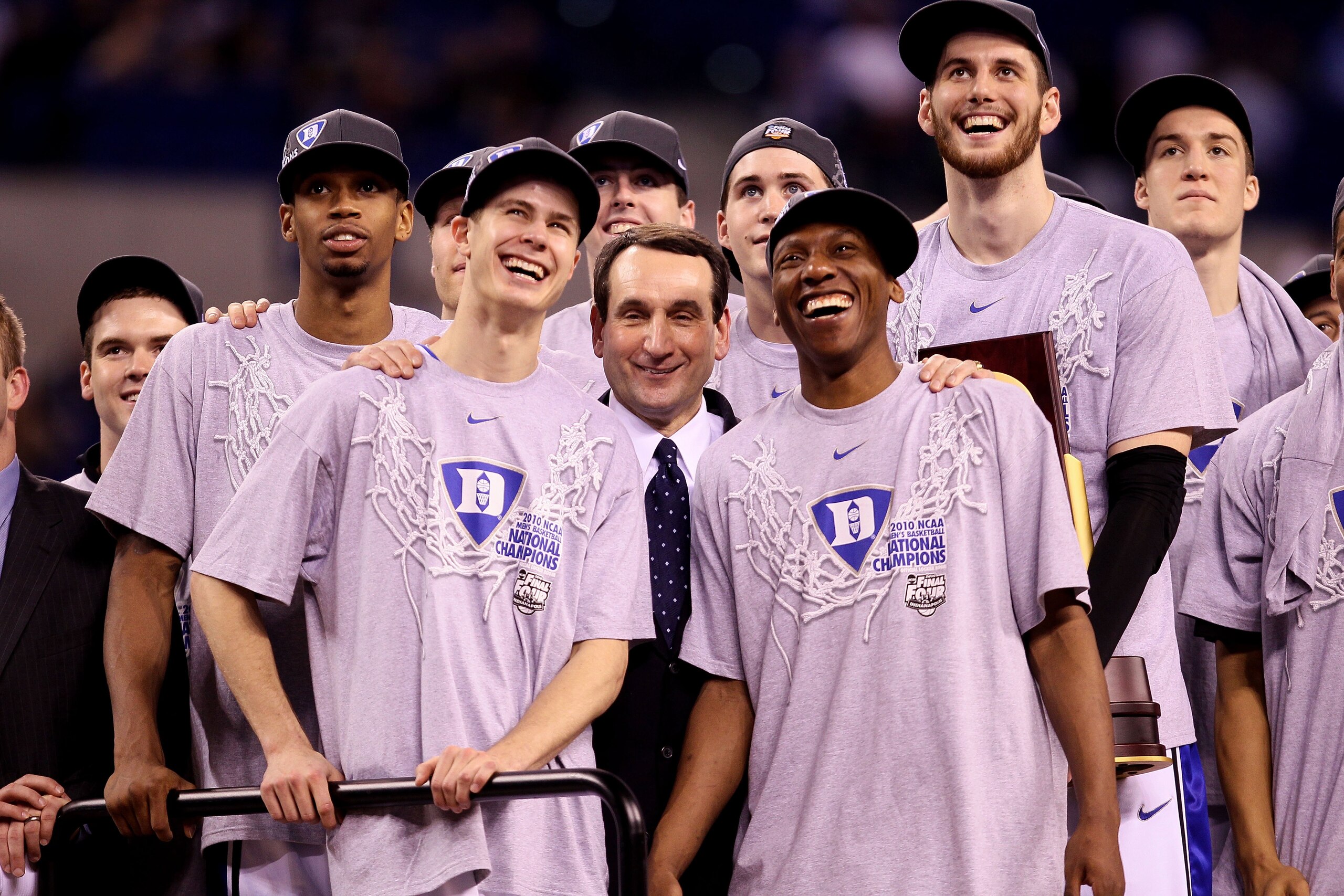 INDIANAPOLIS - APRIL 05:  (L-R) Lance Thomas #42 Jon Scheyer #30, head coach Mike Krzyzewski, Nolan Smith #2 and Brian Zoubek #55 of the Duke Blue Devils watch CBS 's presentation of 'One Shining Moment' as they celebrate after they won 61-59 against the 