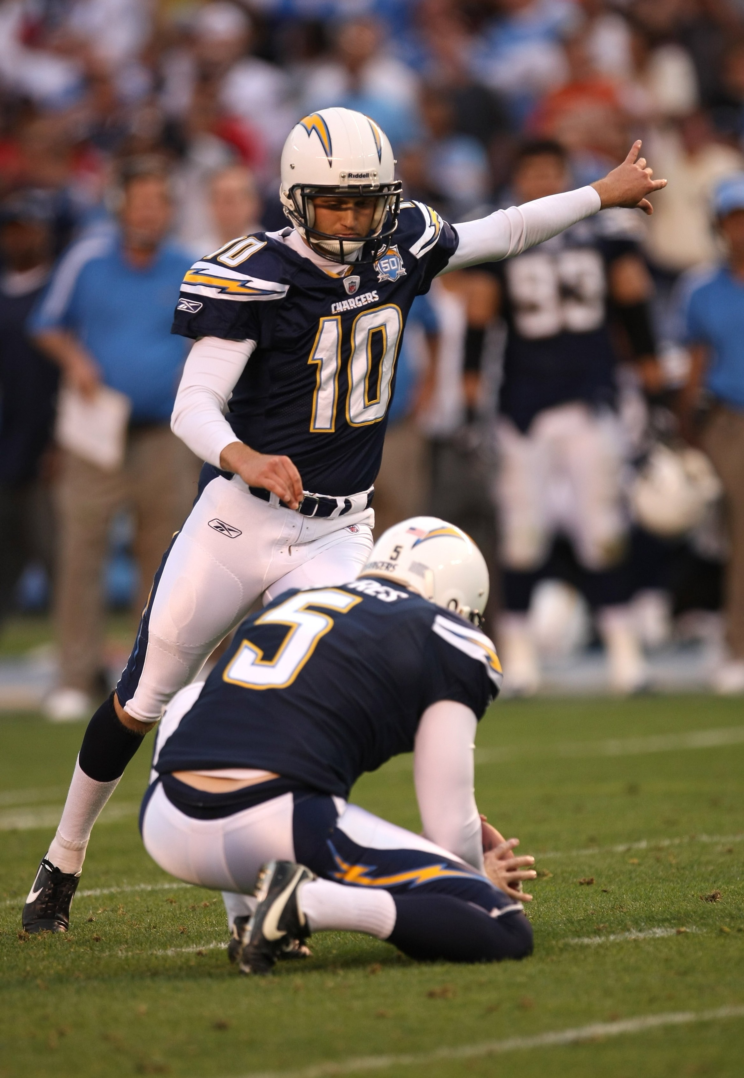 SAN DIEGO - DECEMBER 20:  Nate Kaeding #10 of the San Diego Chargers kicks the game winning field goal with three seconds left in the game against the Cincinnati Bengals as Mike Scifres holds on December 20, 2009 at Qualcomm Stadium in San Diego, Californ