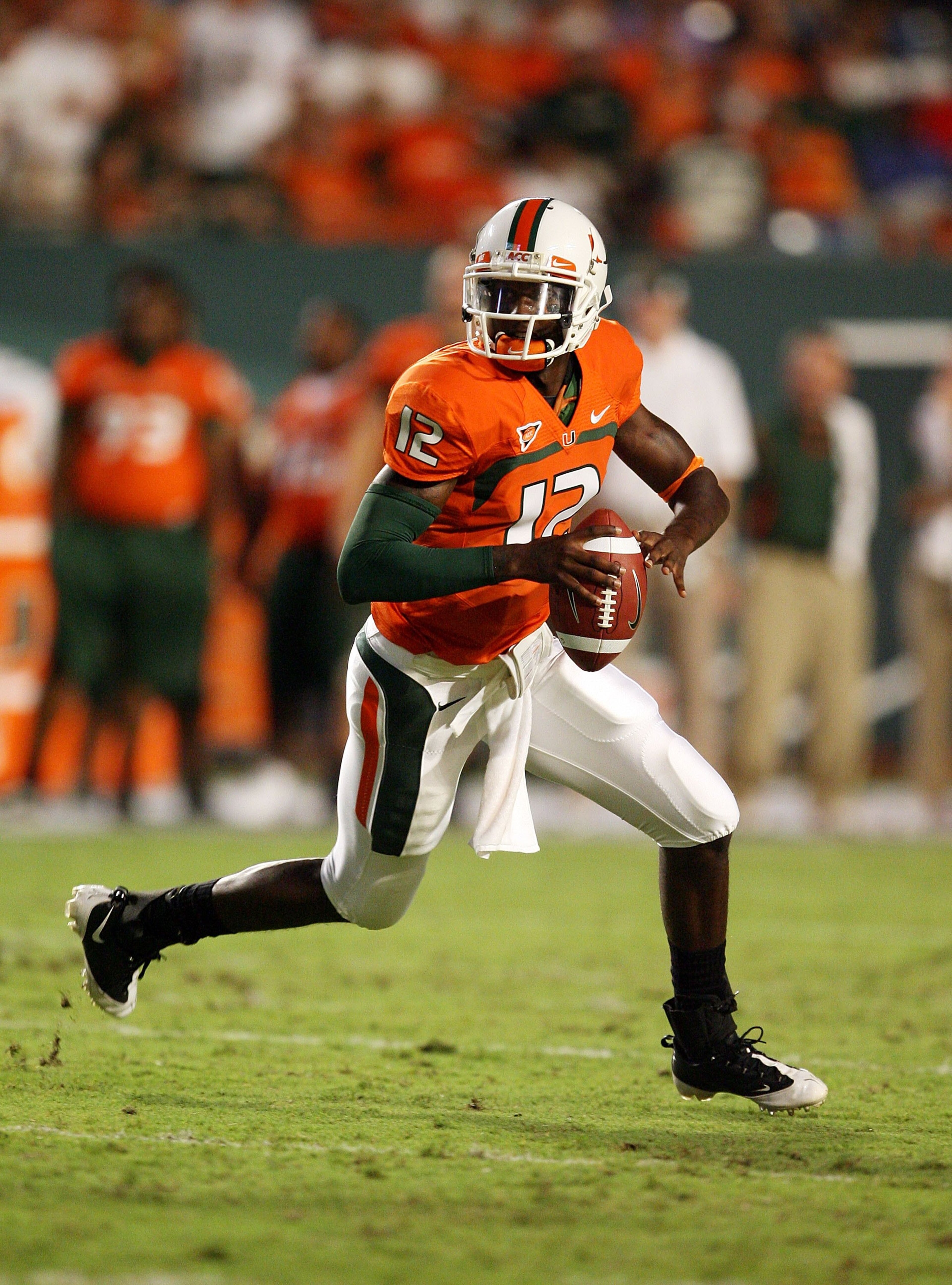 MIAMI GARDENS, FL - SEPTEMBER 17:  Quarterback Jacory Harris #12 of the Miami Hurricanes scrambles against the Georgia Tech Yellow Jackets at Land Shark Stadium on September 17, 2009 in Miami Gardens, Florida. Miami defeated Georgia Tech 33-17.  (Photo by