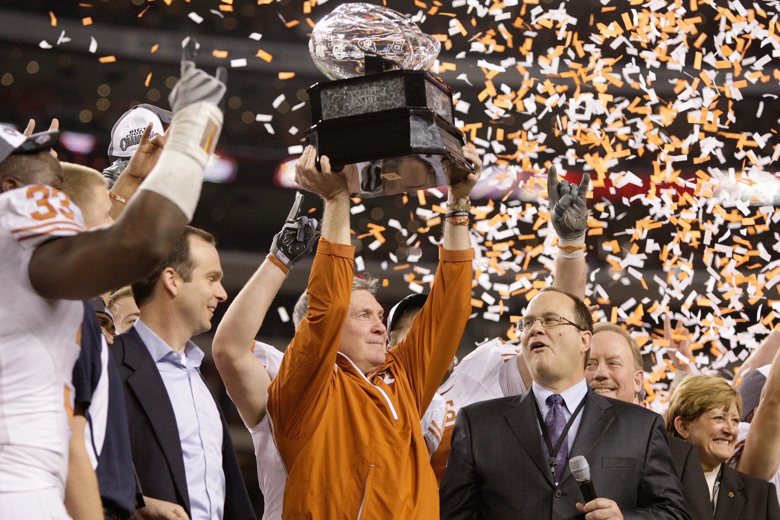 ARLINGTON, TX - DECEMBER 5: Head coach Mack Brown of the Texas Longhorns lifts the trophy after his teams 10-6 victory over the Nebraska Cornhuskers in the game at Cowboys Stadium on December 5, 2009 in Arlington, Texas. (Photo by Jamie Squire/Getty Image