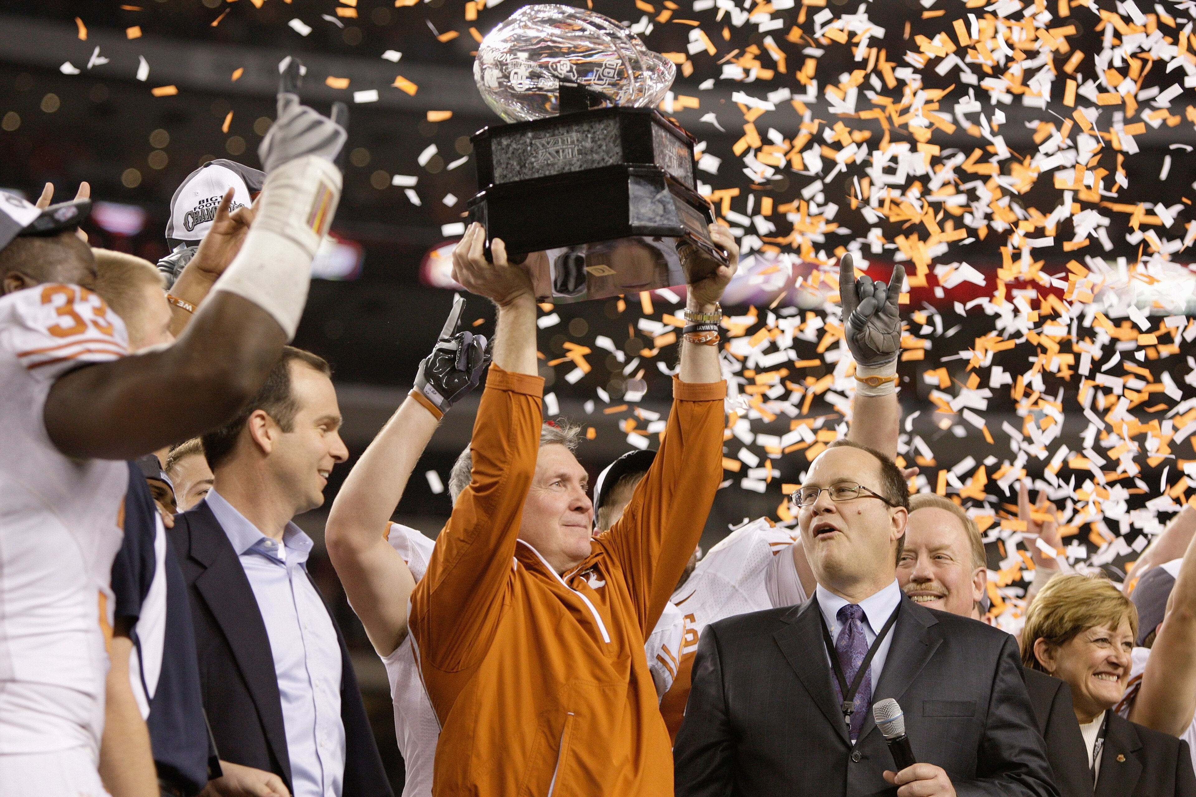 ARLINGTON, TX - DECEMBER 5: Head coach Mack Brown of the Texas Longhorns lifts the trophy after his teams 10-6 victory over the Nebraska Cornhuskers in the game at Cowboys Stadium on December 5, 2009 in Arlington, Texas. (Photo by Jamie Squire/Getty Image