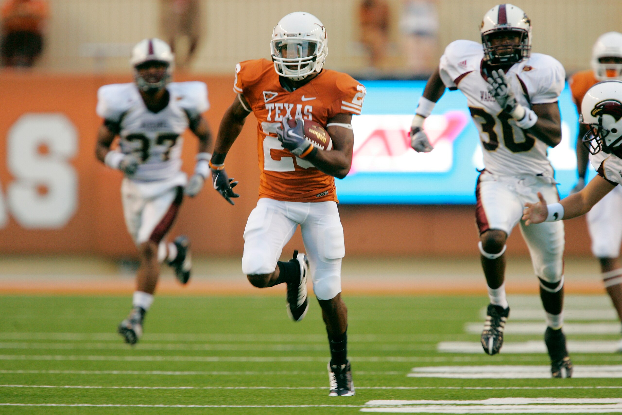 AUSTIN, TX - SEPTEMBER 05:  D.J. Monroe #26 of the Texas Longhorns returns a kickoff for a touchdown against the Louisiana Monroe Warhawks in the second quarter on September 5, 2009 at Darrell K Royal-Texas Memorial Stadium in Austin, Texas.  (Photo by Br