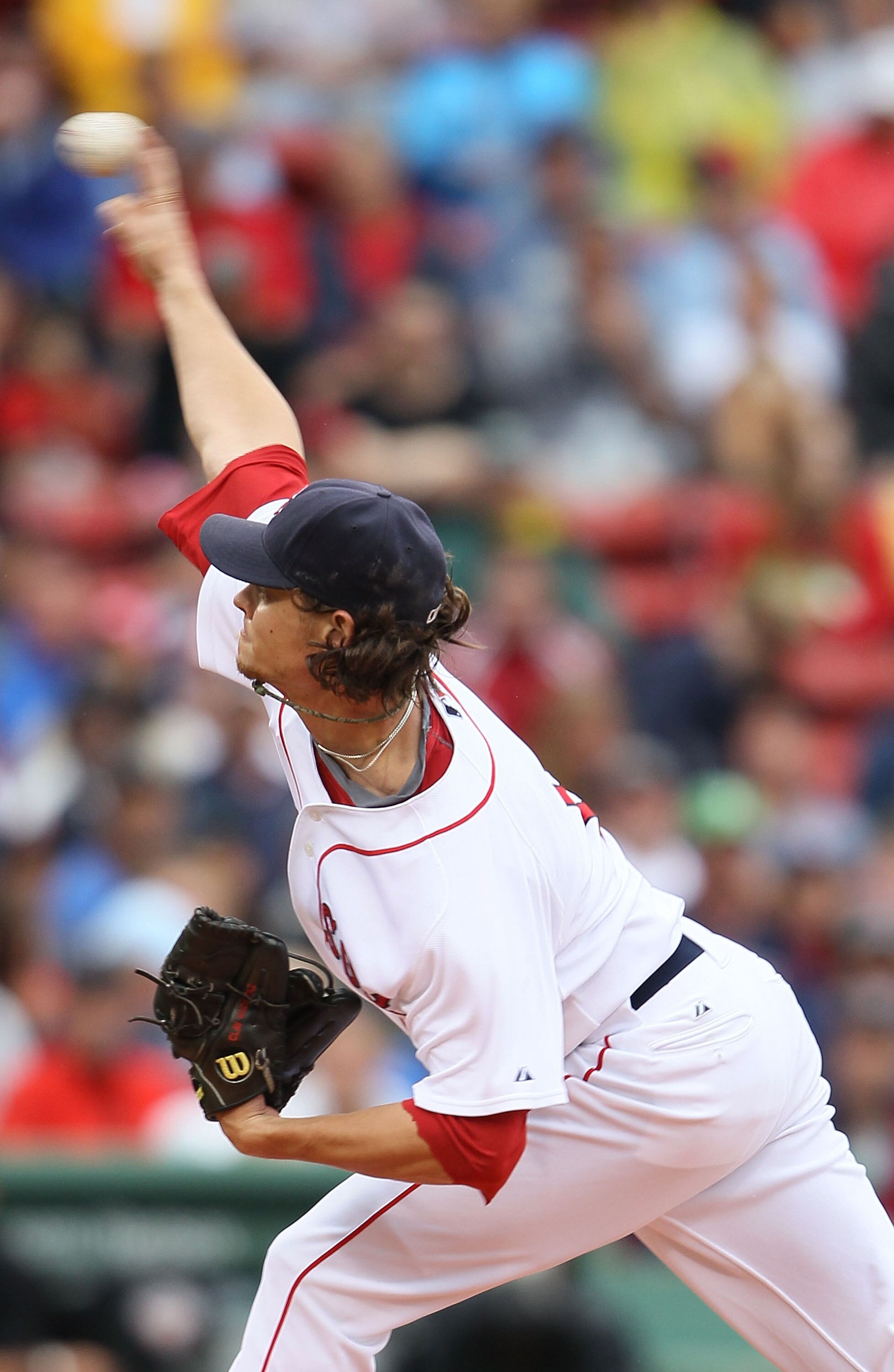 BOSTON - AUGUST 22:  Clay Buchholz #11 of the Boston Red Sox delivers a pitch in the first inning against the Toronto Blue Jays on August 22, 2010 at Fenway Park in Boston, Massachusetts.  (Photo by Elsa/Getty Images)