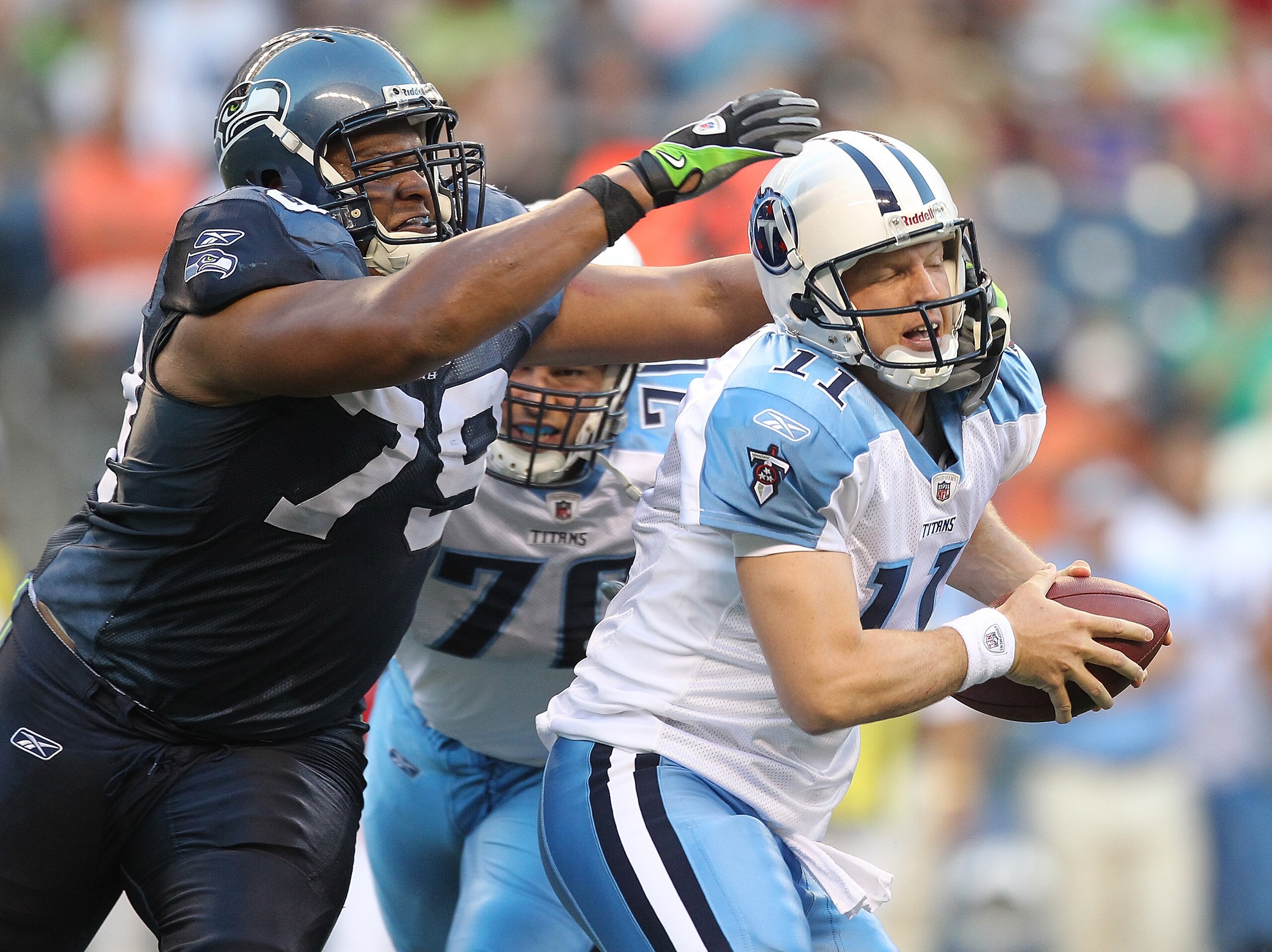 SEATTLE - AUGUST 14: Quarterback Chris Simms #11 of the Tennessee Titans is sacked during the preseason game by Red Bryant #79 of the Seattle Seahawks at Qwest Field on August 14, 2010 in Seattle, Washington. (Photo by Otto Greule Jr/Getty Images)
