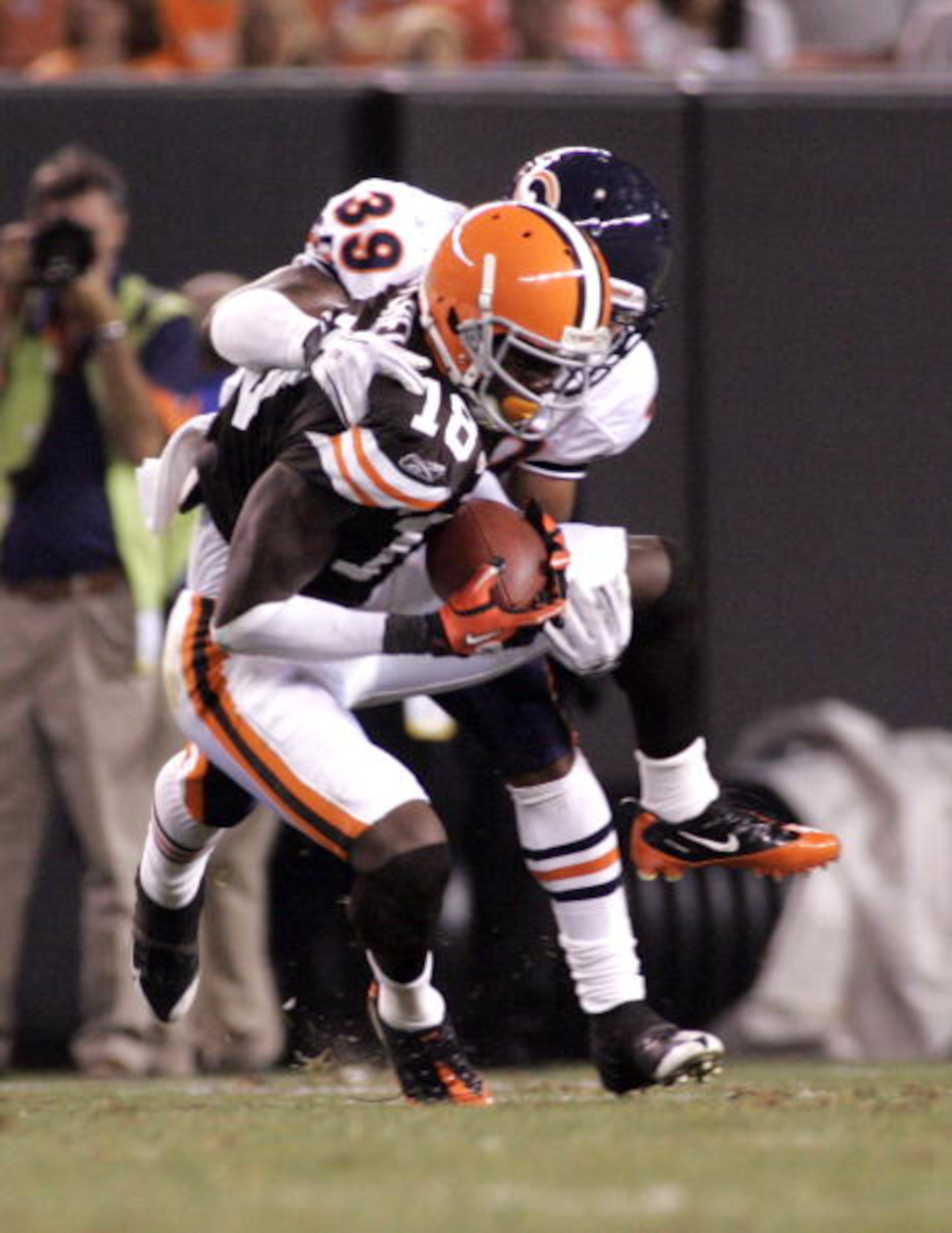 CLEVELAND - SEPTEMBER 2: Carlton Mitchell #18 of the Cleveland Browns pulls in a catch against Cornelius Brown #39 of the Chicago Bears during the preseason game on September 2, 2010 at Cleveland Browns Stadium in Cleveland, Ohio. The Browns defeated the CLEVELAND - SEPTEMBER 2: Carlton Mitchell #18 of the Cleveland Browns pulls in a catch against Cornelius Brown #39 of the Chicago Bears during the preseason game on September 2, 2010 at Cleveland Browns Stadium in Cleveland, Ohio. The Browns defeated the