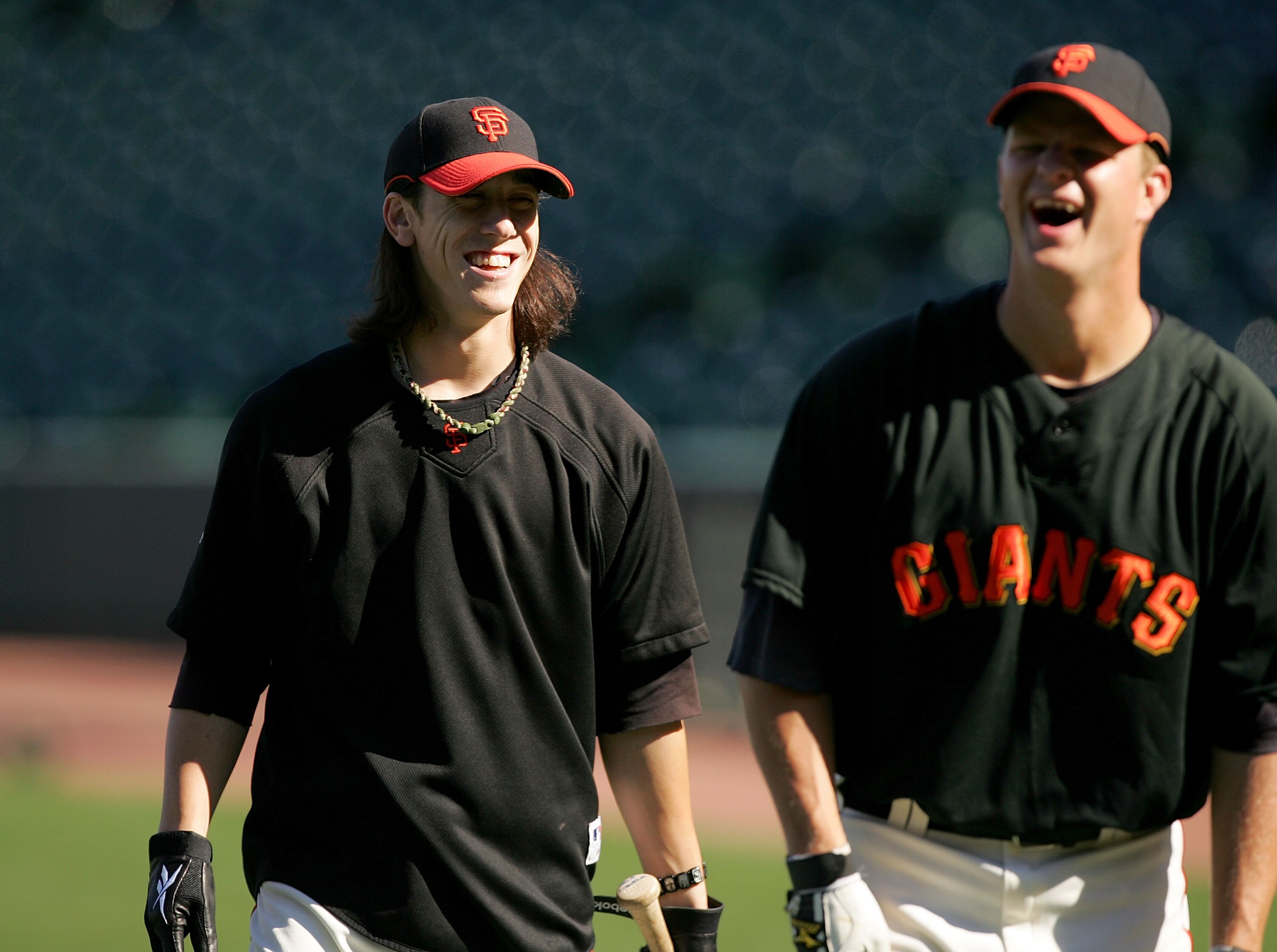 SAN FRANCISCO - AUGUST 26:  Tim Lincecum #55 of the San Francisco Giants jokes with Matt Cain #18 during batting practice before their game against the Arizona Diamondbacks at AT&T Park on August 26, 2009 in San Francisco, California.  (Photo by Ezra Shaw