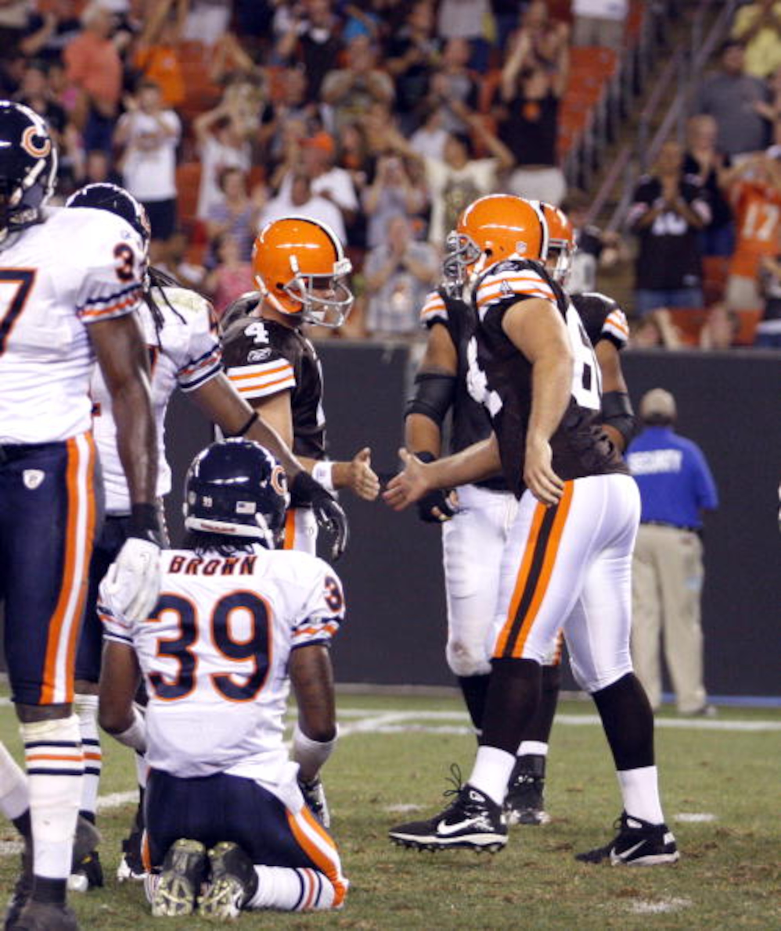 CLEVELAND - SEPTEMBER 2:  Phil Dawson #4 of the Cleveland Browns celebrates his winning field goal with Robert Royal #84 against the Chicago Bears during the preseason game on September 2, 2010 at Cleveland Browns Stadium in Cleveland, Ohio. The Browns de