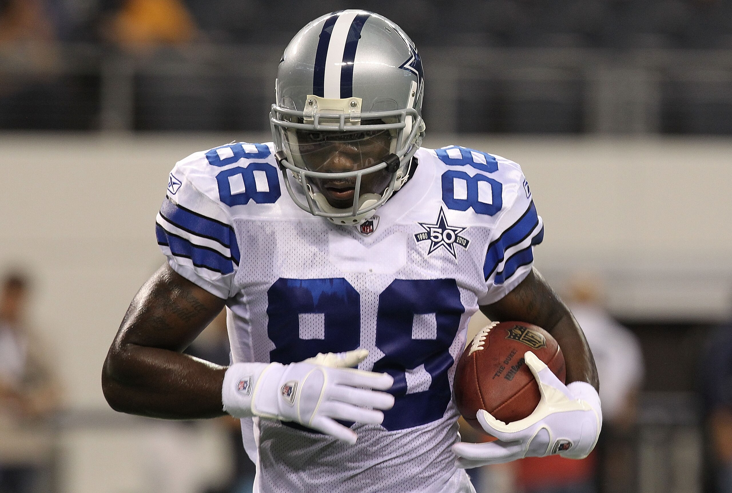 ARLINGTON, TX - SEPTEMBER 02:  Wide receiver Dez Bryant #88 of the Dallas Cowboys holds the ball before a preseason game against the Miami Dolphins at Cowboys Stadium on September 2, 2010 in Arlington, Texas.  (Photo by Ronald Martinez/Getty Images)
