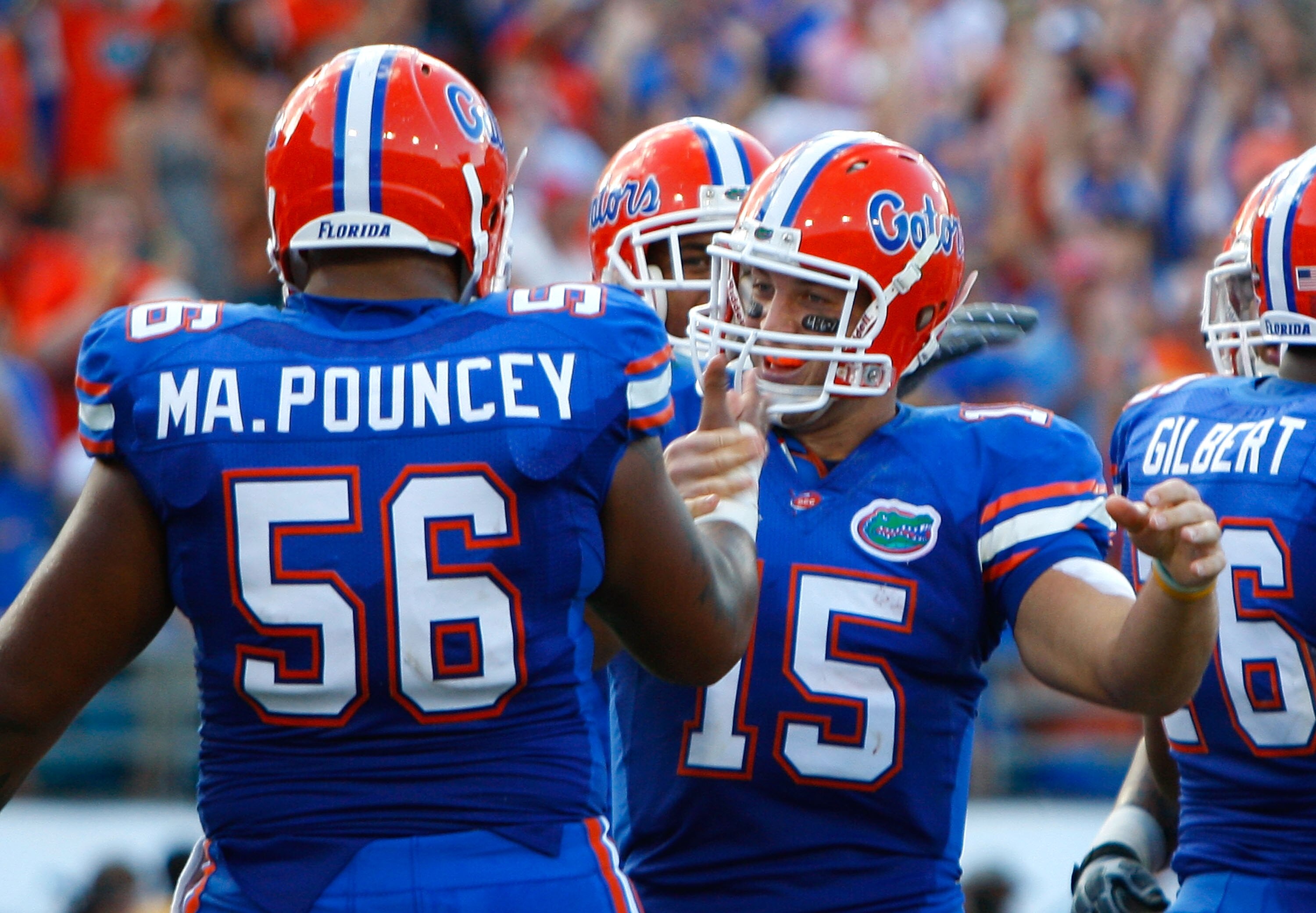 JACKSONVILLE, FL - OCTOBER 31:  Quarterback Tim Tebow #15 of the Florida Gators celebrates his rushing touchdown against the Georgia Bulldogs with Maurkice Pouncey #56 at Jacksonville Municipal Stadium on October 31, 2009 in Jacksonville, Florida.  (Photo