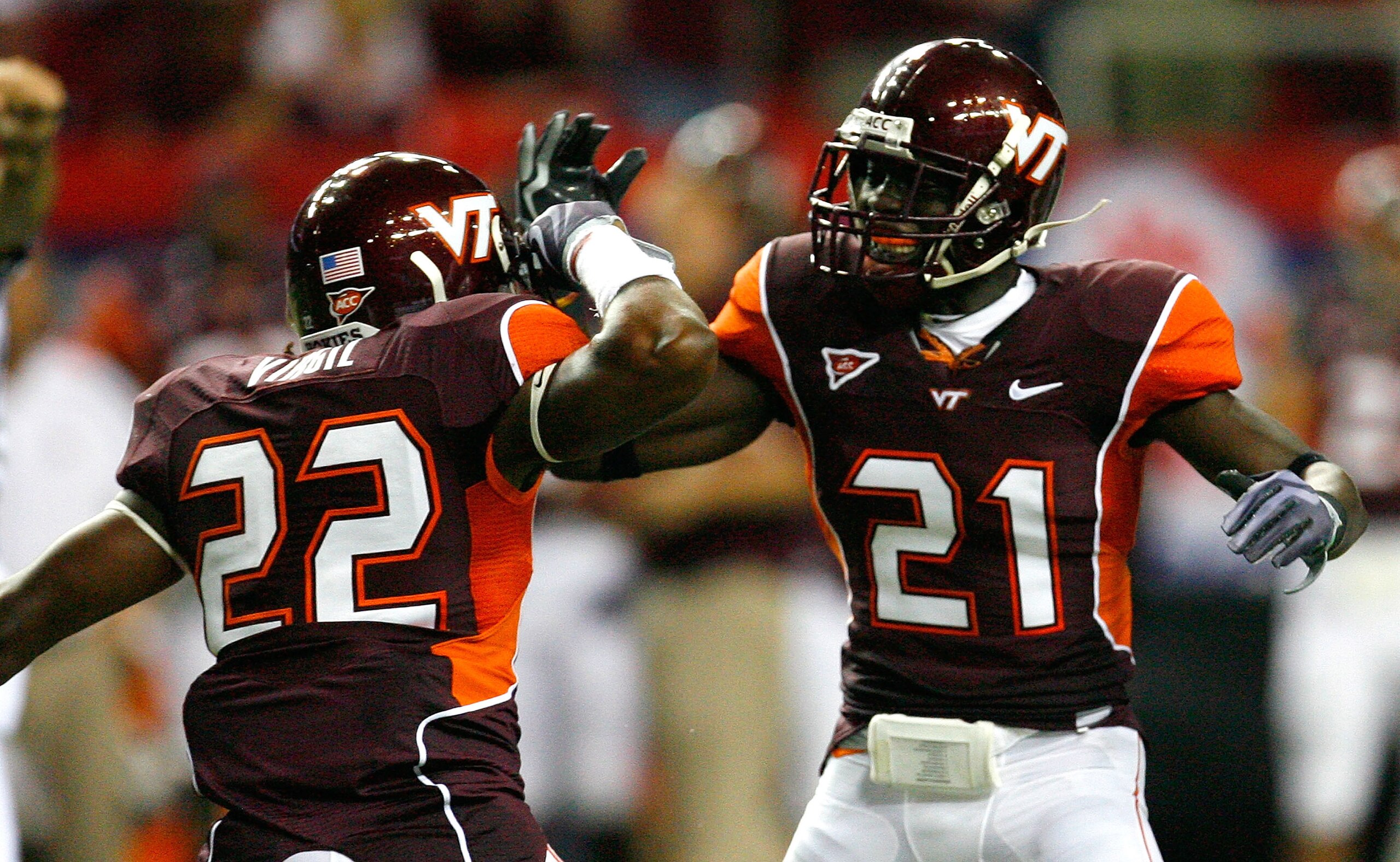 ATLANTA - SEPTEMBER 05:  Stephan Virgil #22 and Rashad Carmichael #21 of the Virginia Tech Hokies celebrate a defensive stop against the Alabama Crimson Tide during the Chick-fil-A Kickoff Game at Georgia Dome on September 5, 2009 in Atlanta, Georgia.  (P