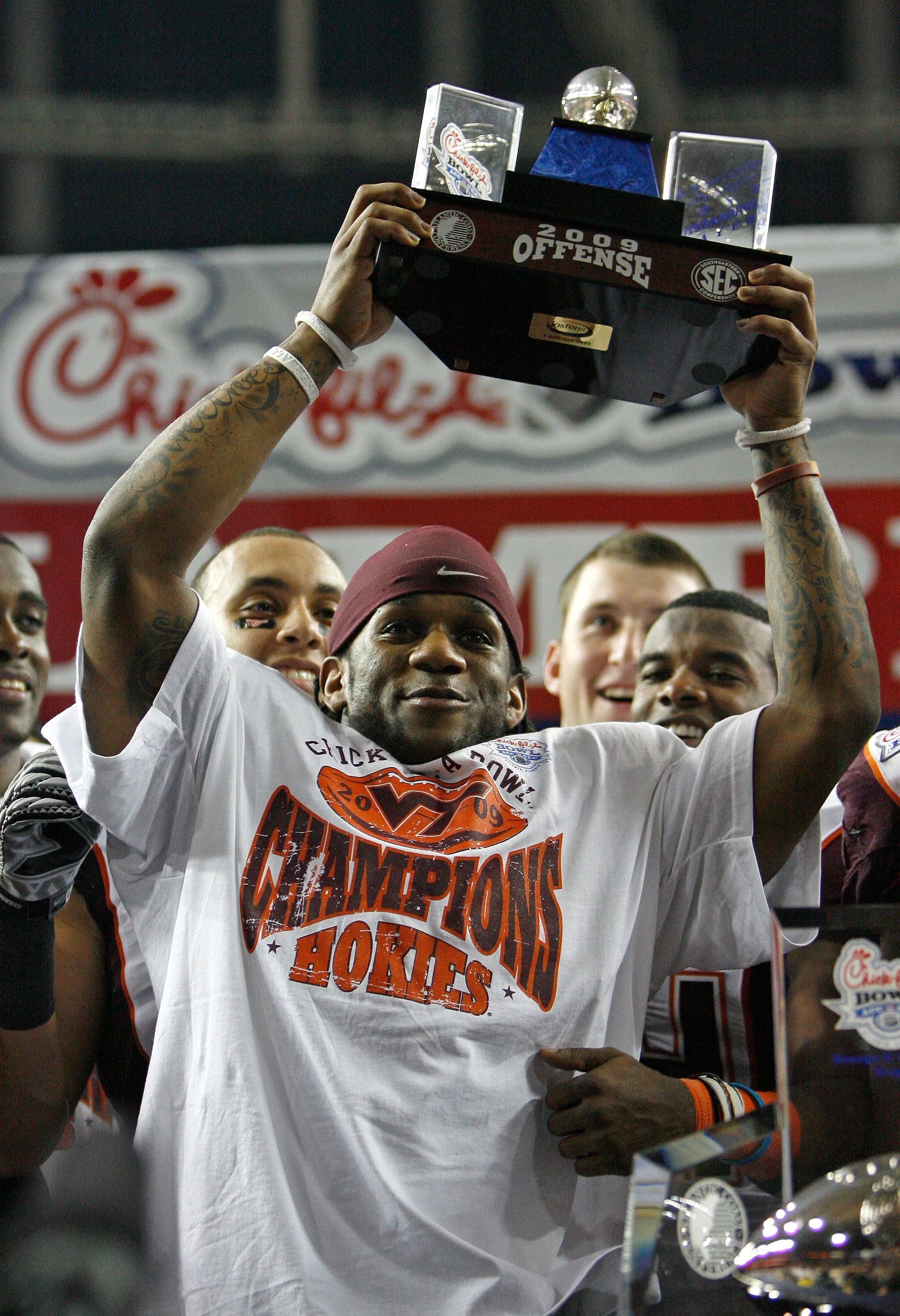 ATLANTA - DECEMBER 31: Tailback Ryan Williams #34 of the Virginia Tech Hokies raises the Most Outstanding Offensive Player trophy after the Chick-fil-A Bowl against the Tennessee Volunteers at the Georgia Dome on December 31, 2009 in Atlanta, Georgia. V ATLANTA - DECEMBER 31: Tailback Ryan Williams #34 of the Virginia Tech Hokies raises the Most Outstanding Offensive Player trophy after the Chick-fil-A Bowl against the Tennessee Volunteers at the Georgia Dome on December 31, 2009 in Atlanta, Georgia. V