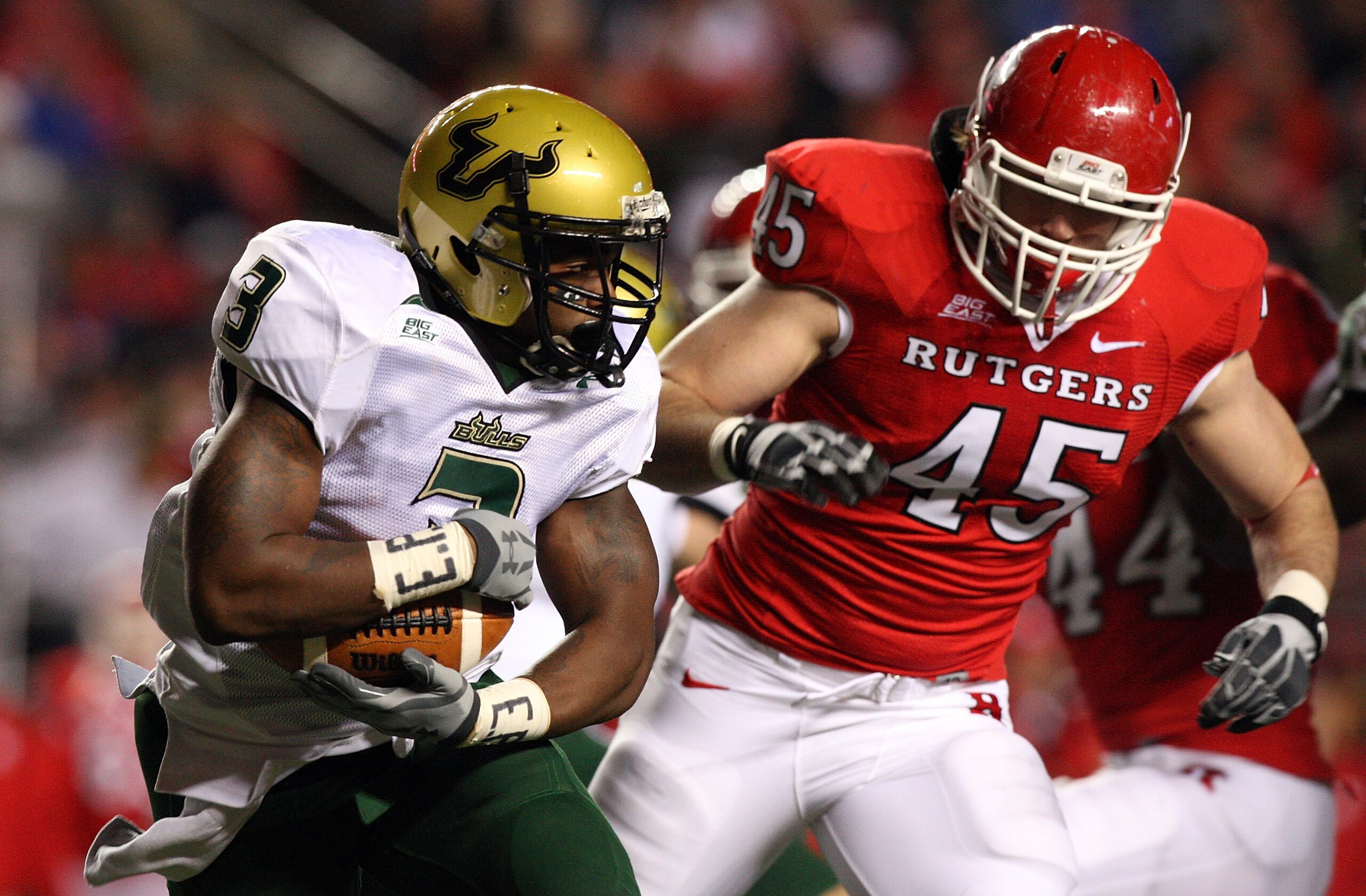 PISCATAWAY, NJ - NOVEMBER 12:  Moise Plancher #3 of the South Florida Bulls runs the ball against Alex Silvestro #45 of the Rutgers Scarlet Knights at Rutgers Stadium on November 12, 2009 in Piscataway, New Jersey.  (Photo by Jim McIsaac/Getty Images)