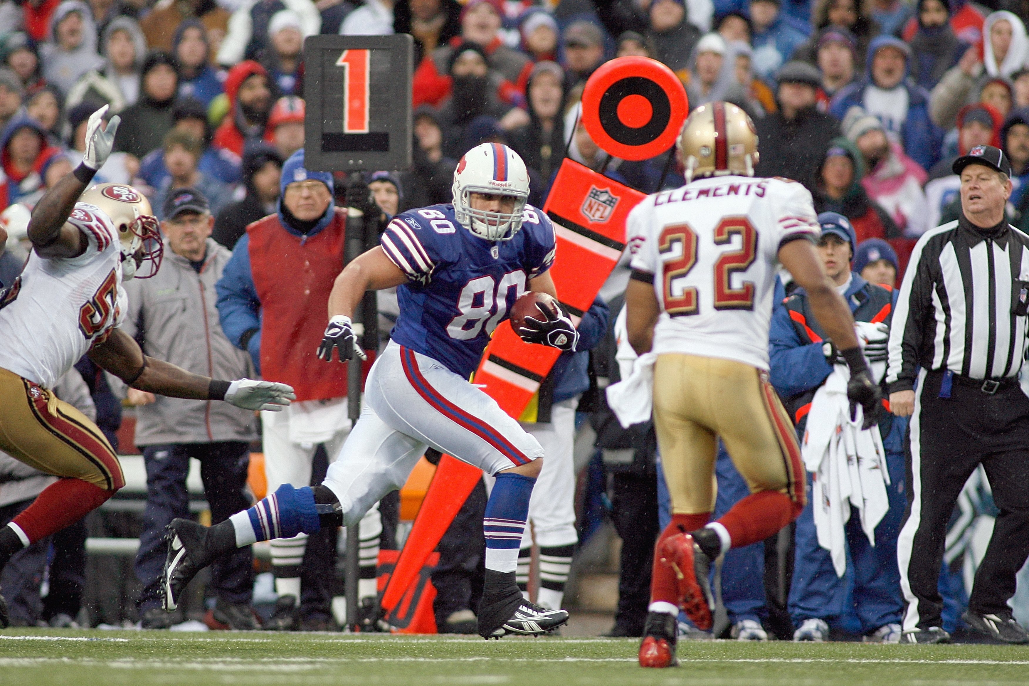 ORCHARD PARK - NOVEMBER 30:  Derek Schouman #80 of the Buffalo Bills carries the ball against Nate Clements #22 of the San Francisco 49ers on November 30, 2008 at Ralph Wilson Stadium in Orchard Park, New York. (Photo by: Rick Stewart/Getty Images)