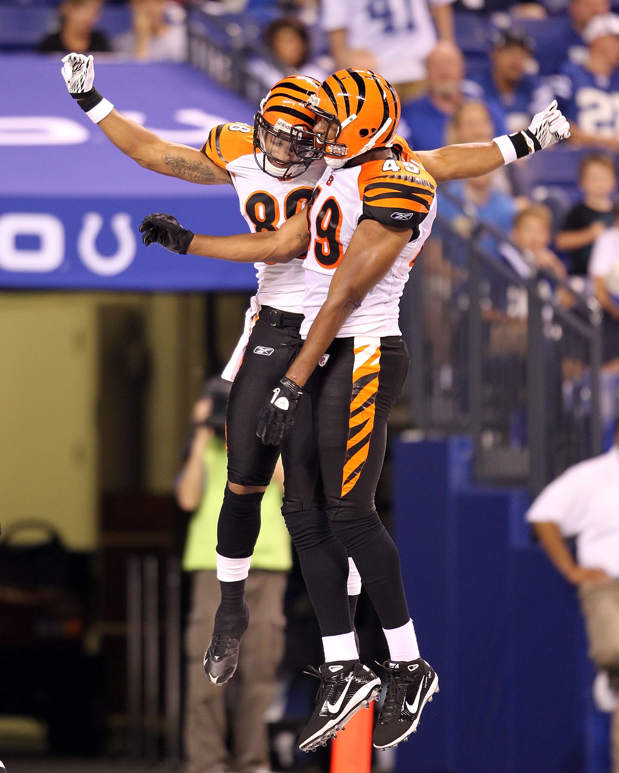 INDIANAPOLIS - SEPTEMBER 02:  Dezmon Briscoe #88 and Darius Hill #49 of the Cincinnati Bengals celebrate after Briscoe caught a touchdown pass during the NFL preseason game against the Indianapolis Colts at Lucas Oil Stadium on September 2, 2010 in Indian