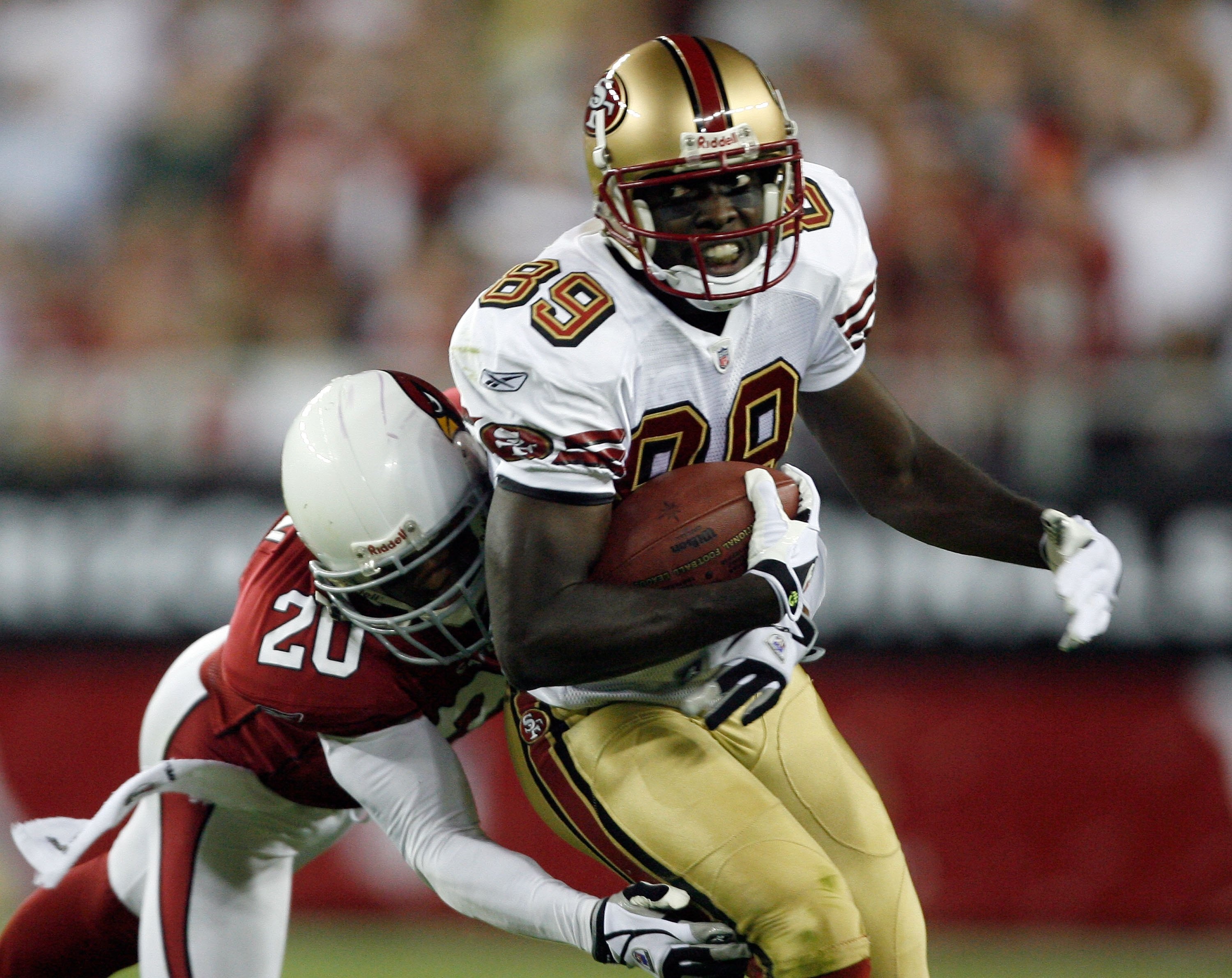GLENDALE, AZ - NOVEMBER 10:  Jason Hill #89 of the San Francisco 49ers turns to run after a catch as he is tackled by Ralph Brown #20 of the Arizona Cardinals during the game at University of Phoenix Stadium on November, 10 2008 in Glendale, Arizona.  (Ph