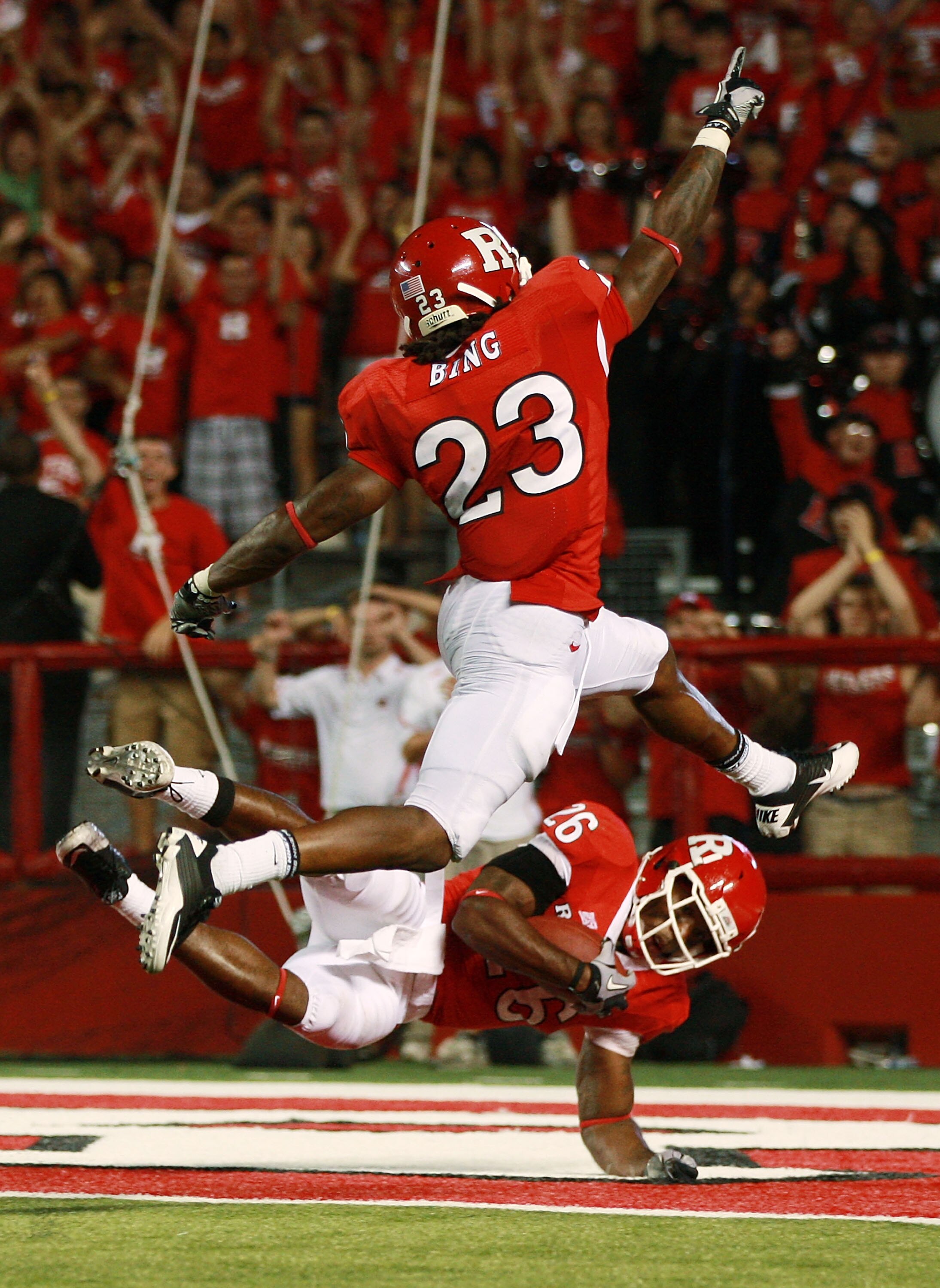NEW BRUNSWICK, NJ - SEPTEMBER 02:  Joe Lefeged #26 of the Rutgers Scarlet Knights scores a touchdown off of a blocked punt while Brandon Bing #23, who blocked the punt, celebrates in the third quarter against the Norfolk State Spartans at Rutgers Stadium