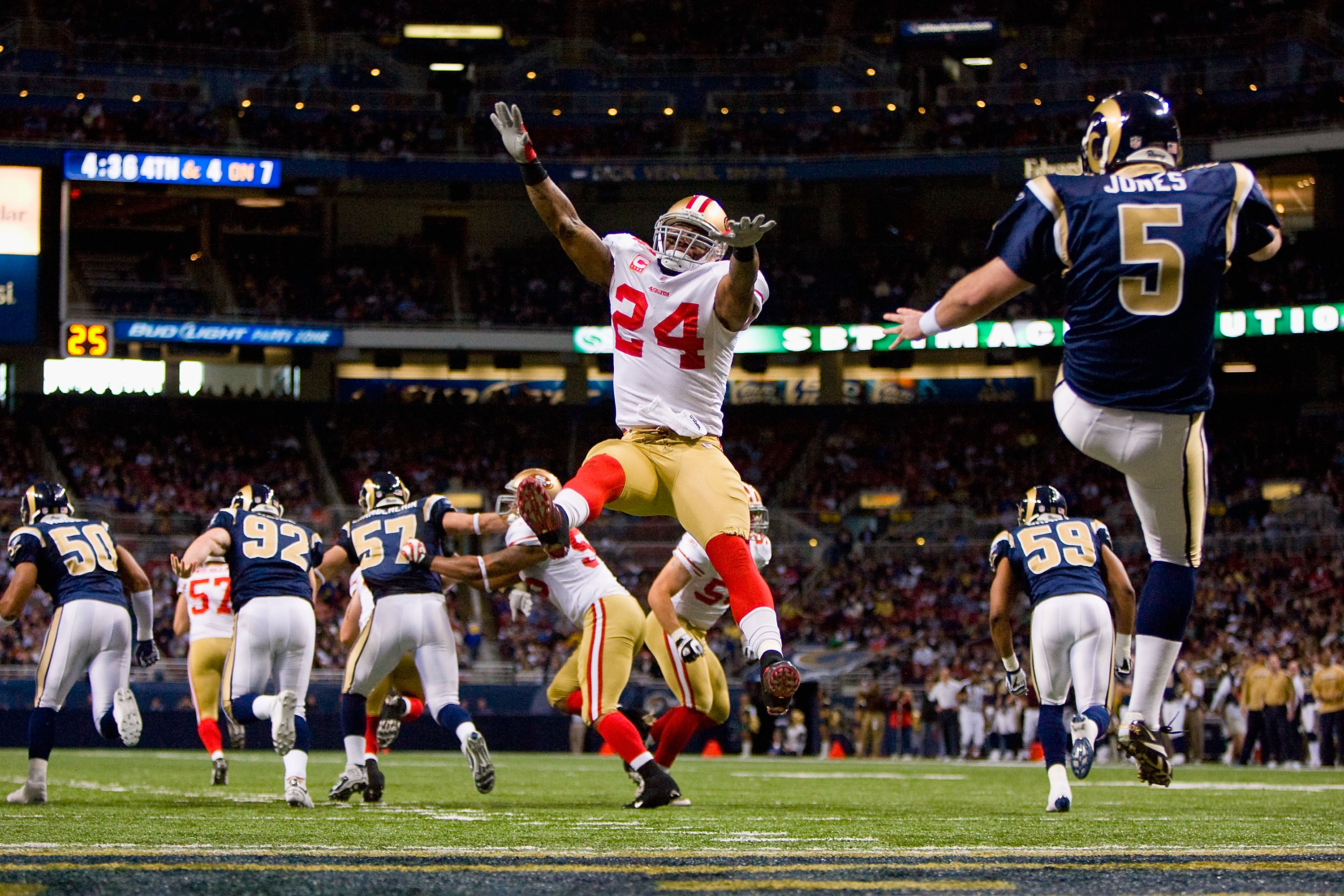 ST. LOUIS - JANUARY 3: Michael Robinson #24 of the San Francisco 49ers looks to block a punt against Donnie Jones #5 of the St. Louis Rams at the Edward Jones Dome on January 3, 2010 in St. Louis, Missouri.  (Photo by Dilip Vishwanat/Getty Images)