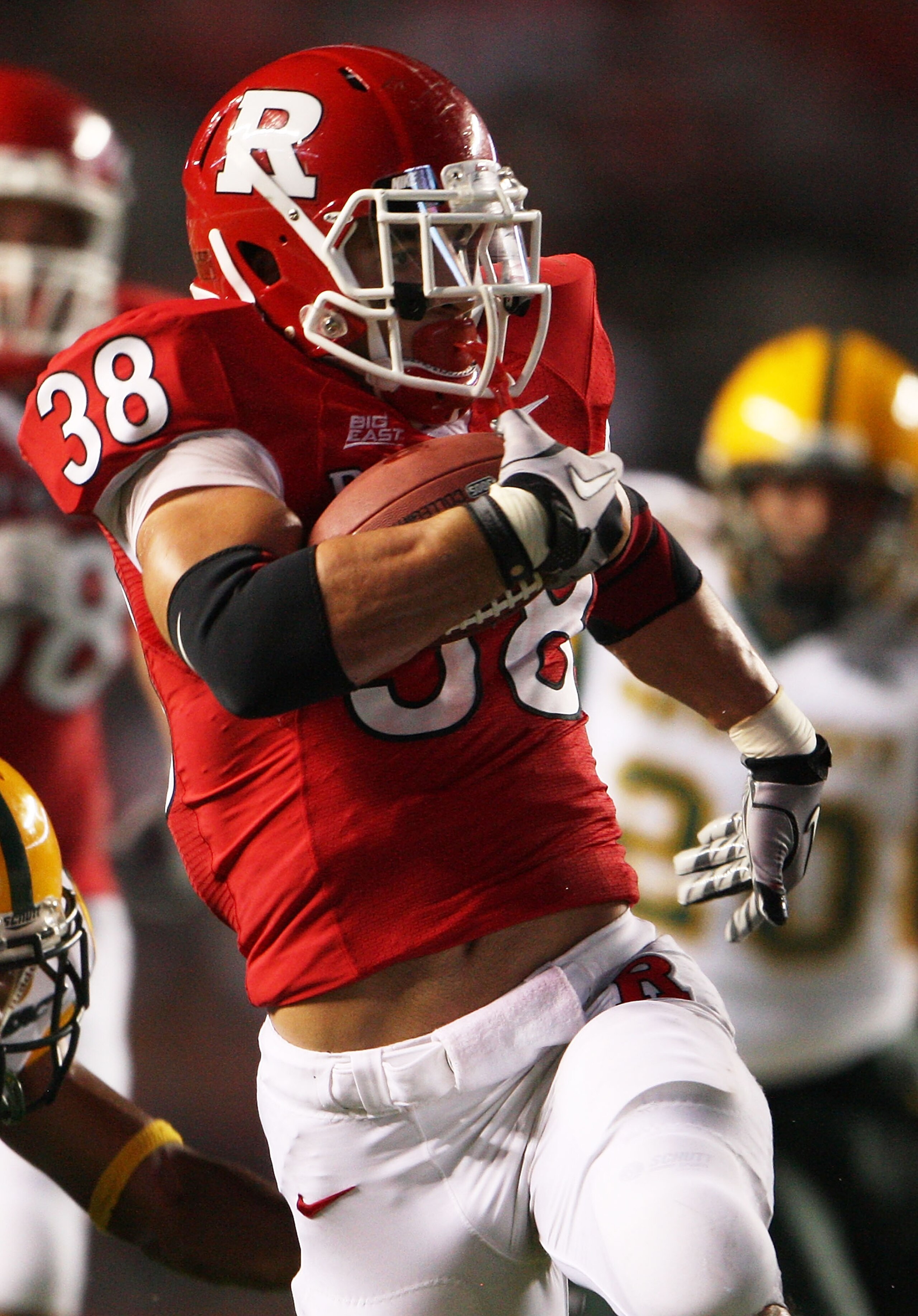 NEW BRUNSWICK, NJ - SEPTEMBER 02:  Joe Martinek #38 of the Rutgers Scarlet Knights runs the ball against the Norfolk State Spartans at Rutgers Stadium on September 2, 2010 in New Brunswick, New Jersey. The Scarlet Knights beat the Spartans 31 - 0.  (Photo
