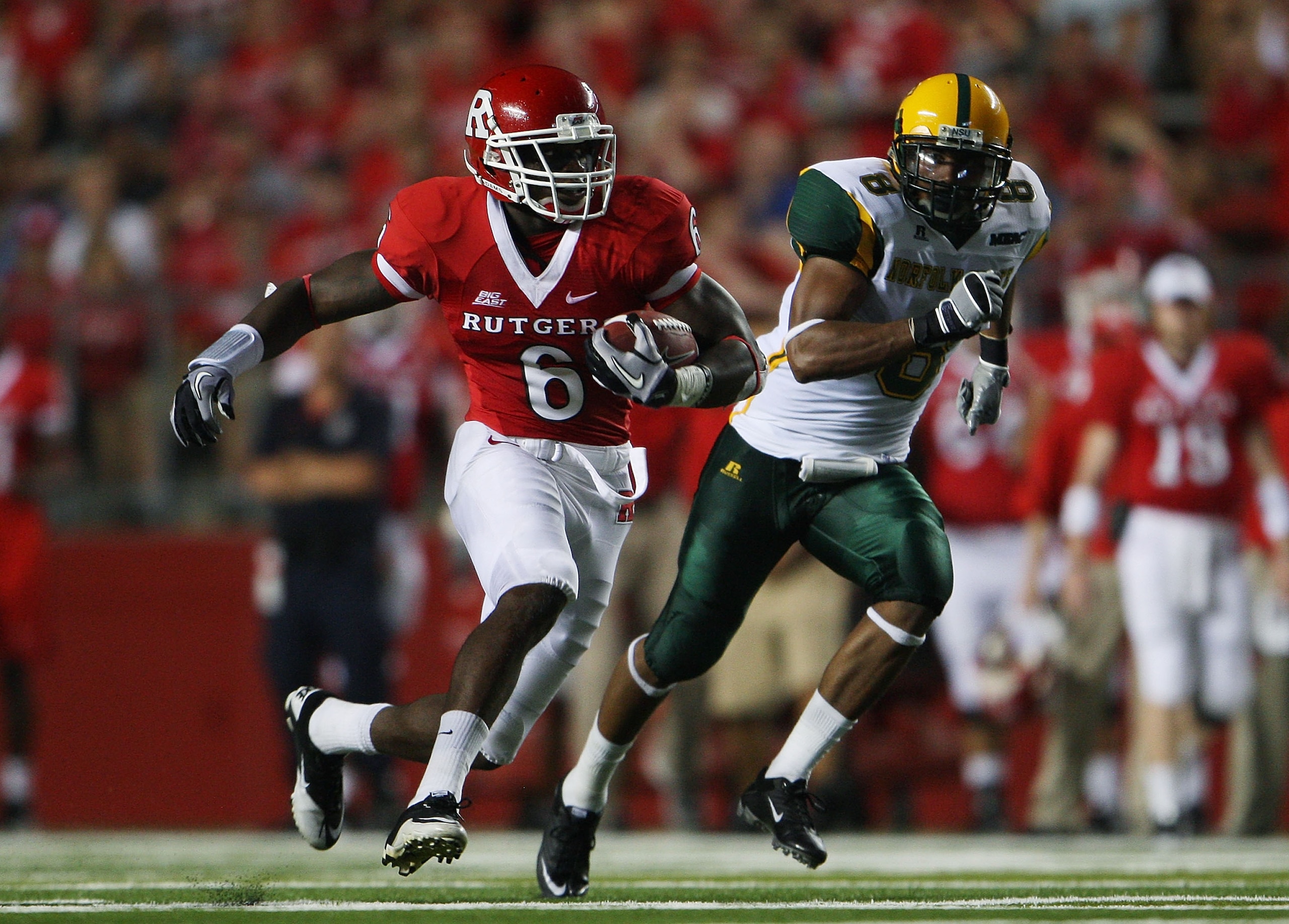 NEW BRUNSWICK, NJ - SEPTEMBER 02:  Mohamed Sanu #6 (L) of the Rutgers Scarlet Knights runs the ball against the Norfolk State Spartans at Rutgers Stadium on September 2, 2010 in New Brunswick, New Jersey. The Scarlet Knights beat the Spartans 31 - 0.  (Ph