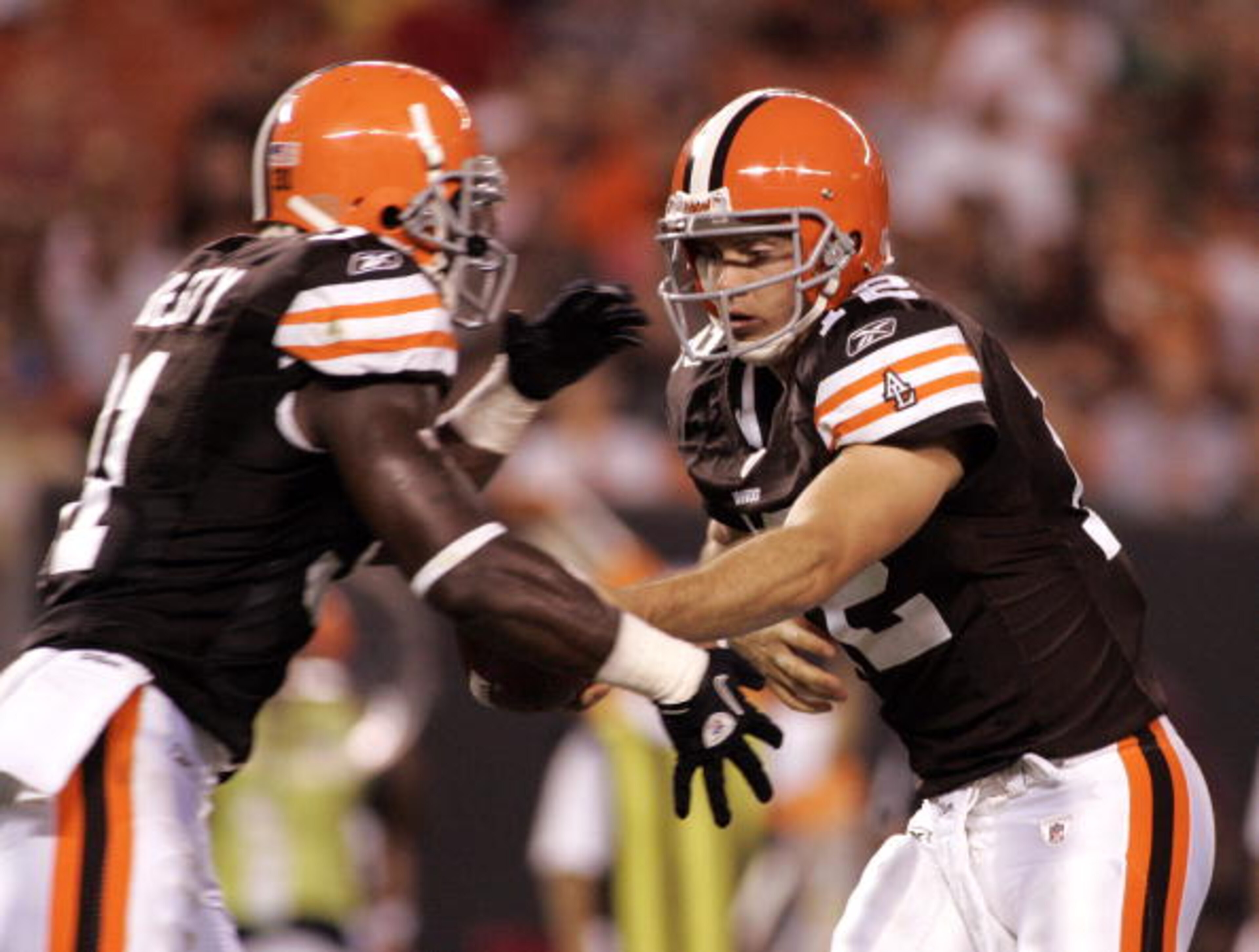CLEVELAND - SEPTEMBER 2:  Colt McCoy #12 of the Cleveland Browns hands the ball off to Montario Hardesty #31 against the Chicago Bears during the preseason game on September 2, 2010 at Cleveland Browns Stadium in Cleveland, Ohio. The Browns defeated the B