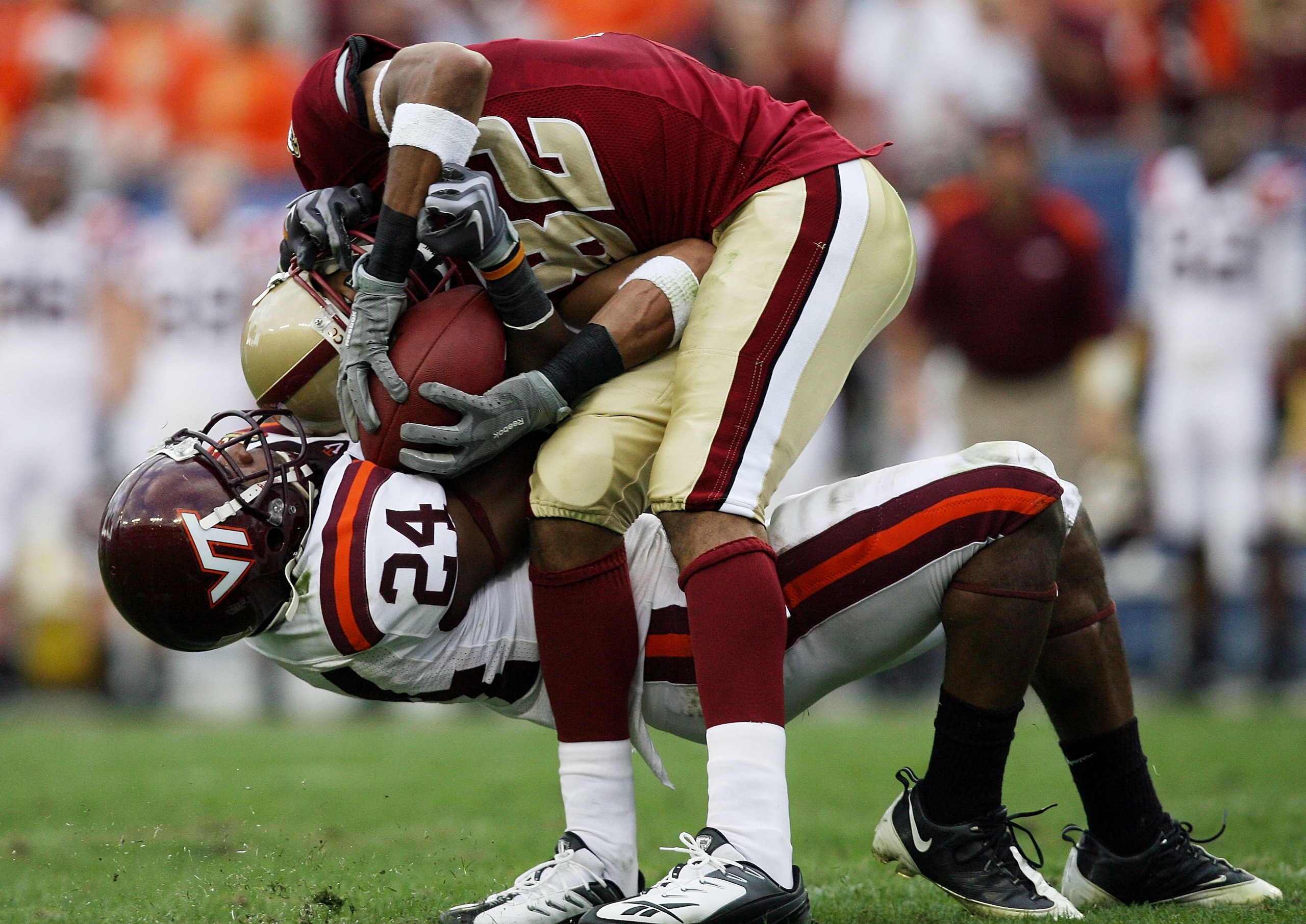 TAMPA, FL - DECEMBER 06:  Wide receiver Justin Jarvis #82 of the Boston College Eagles comes down with a catch despite the defense of Dorian Porch #24 of the Virginia Tech Hokies in the 2008 ACC Football Championship game at the Raymond James Stadium on D