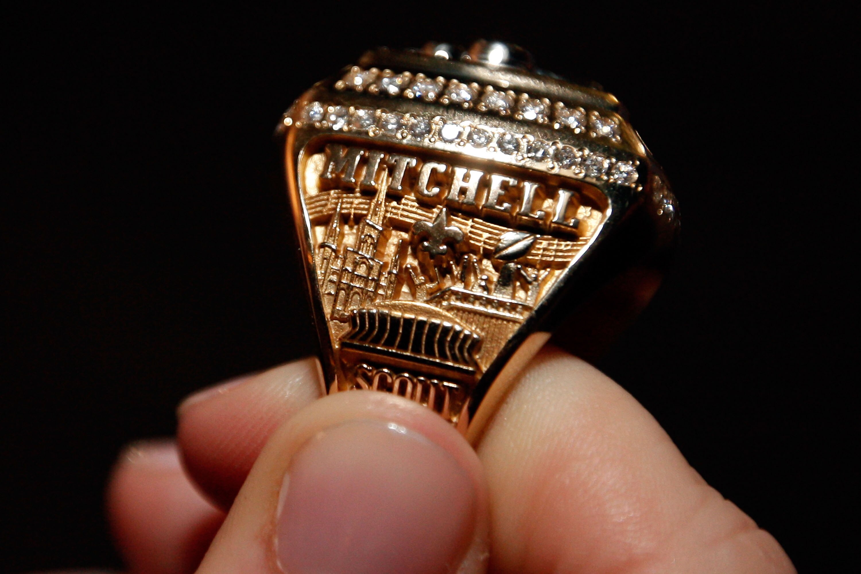 NEW ORLEANS - JUNE 16:  A member of the New Orleans Saints shows off their ring from Super Bowl XLIV on June 16, 2010 in New Orleans, Louisiana.  (Photo by Chris Graythen/Getty Images)