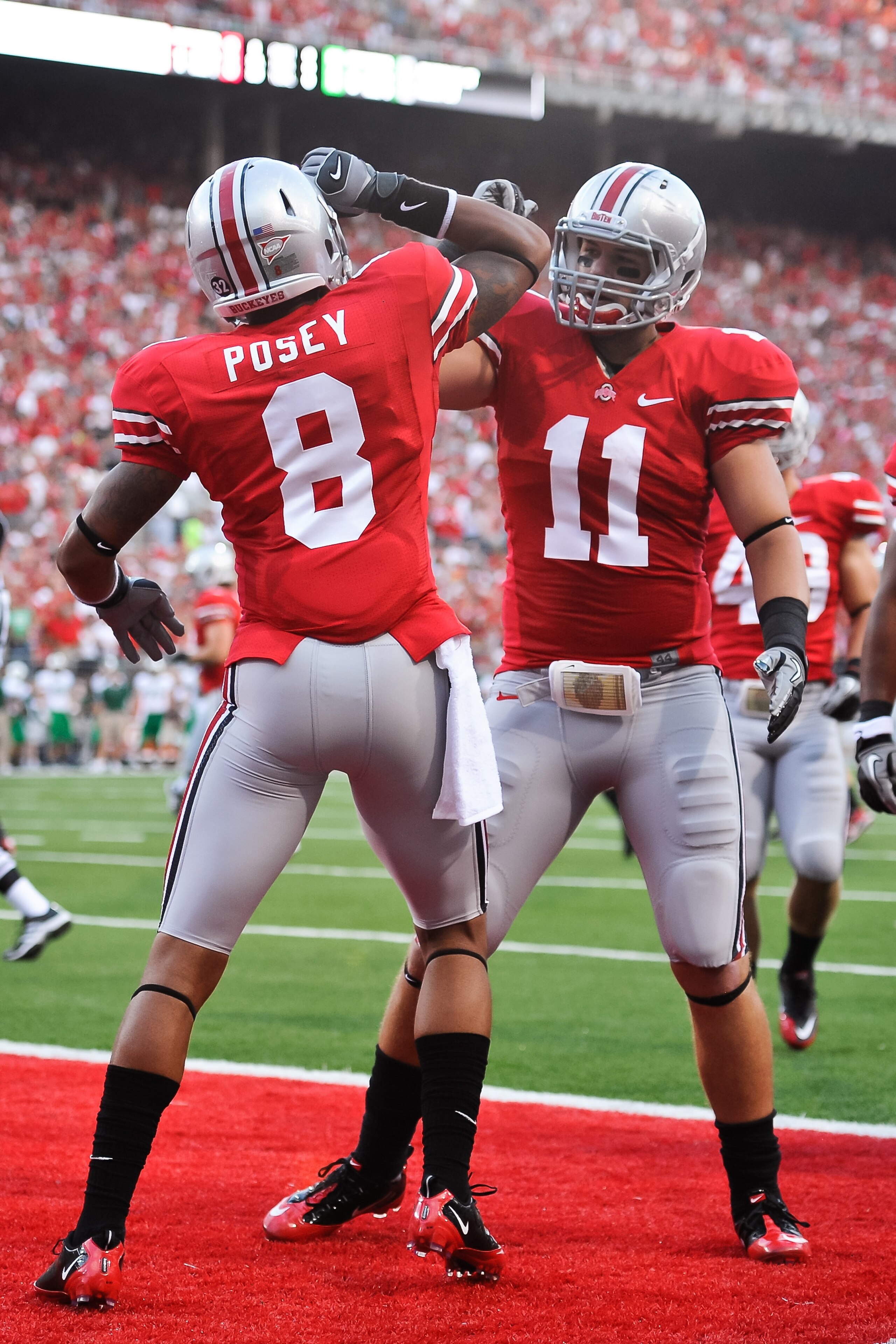COLUMBUS, OH - SEPTEMBER 2: DeVier Posey #8 of the Ohio State Buckeyes and Jake Stoneburner #11 of the Ohio State Buckeyes celebrate a touchdown against the Marshall Thundering Herd at Ohio Stadium on September 2, 2010 in Columbus, Ohio. (Photo by Jamie S